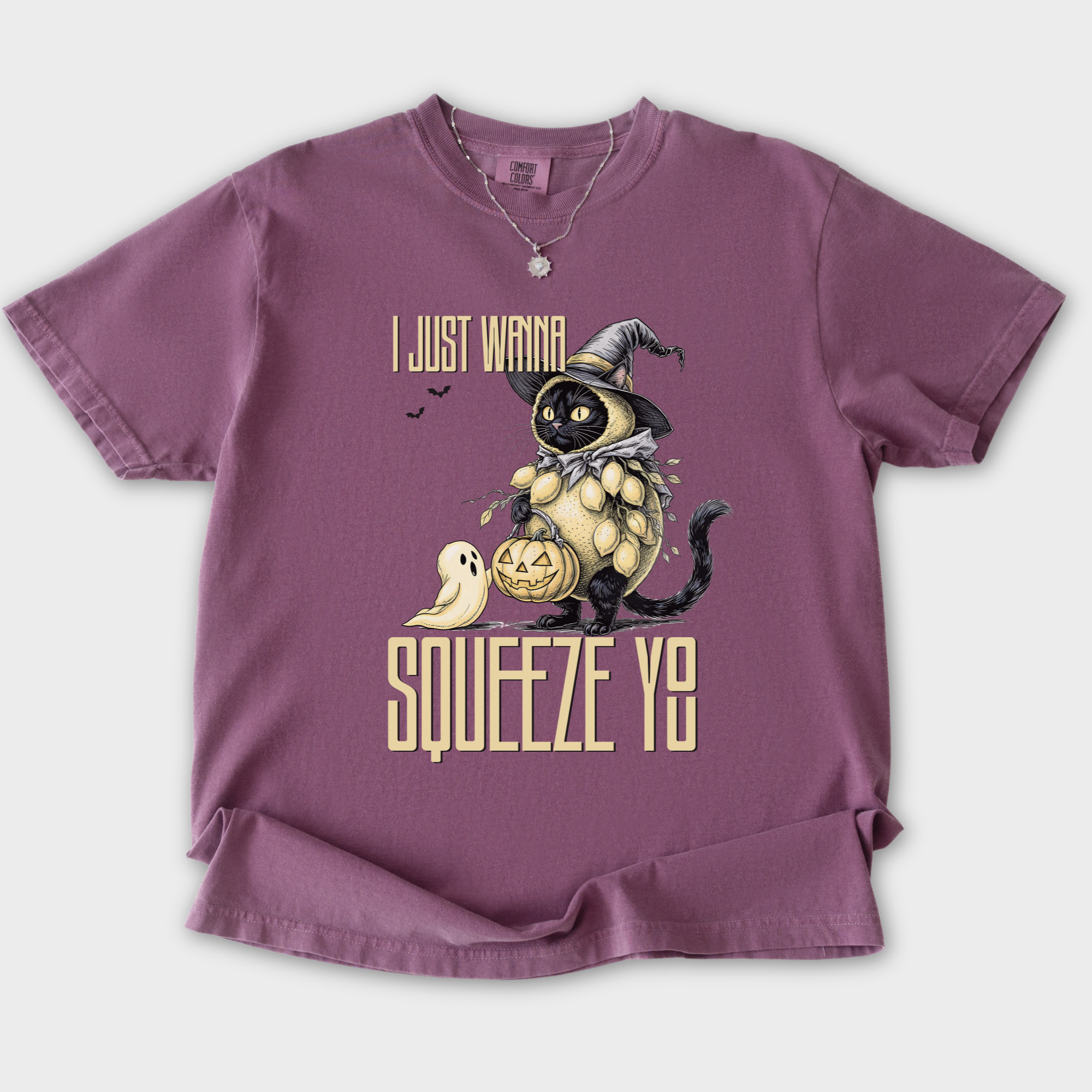 line-art-i-just-wanna-squeeze-you-lemon-trick-or-treater-cat-graphic-comfort-colors-t-shirt-in-berry - Berry Flat Lay Front