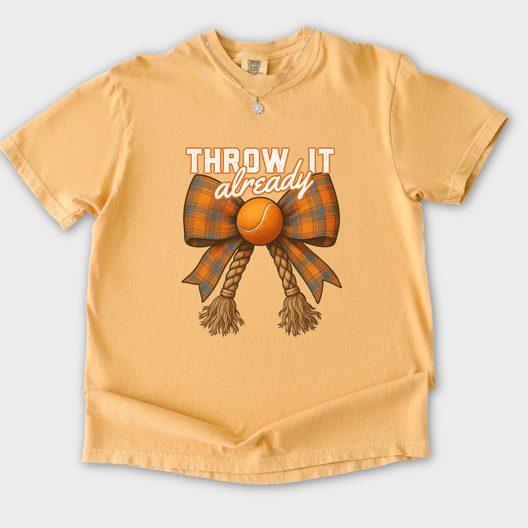 western-throw-it-already-dog-chew-toy-bow-dog-bow-comfort-colors-t-shirt-in-mustard - Mustard Flat Lay Front