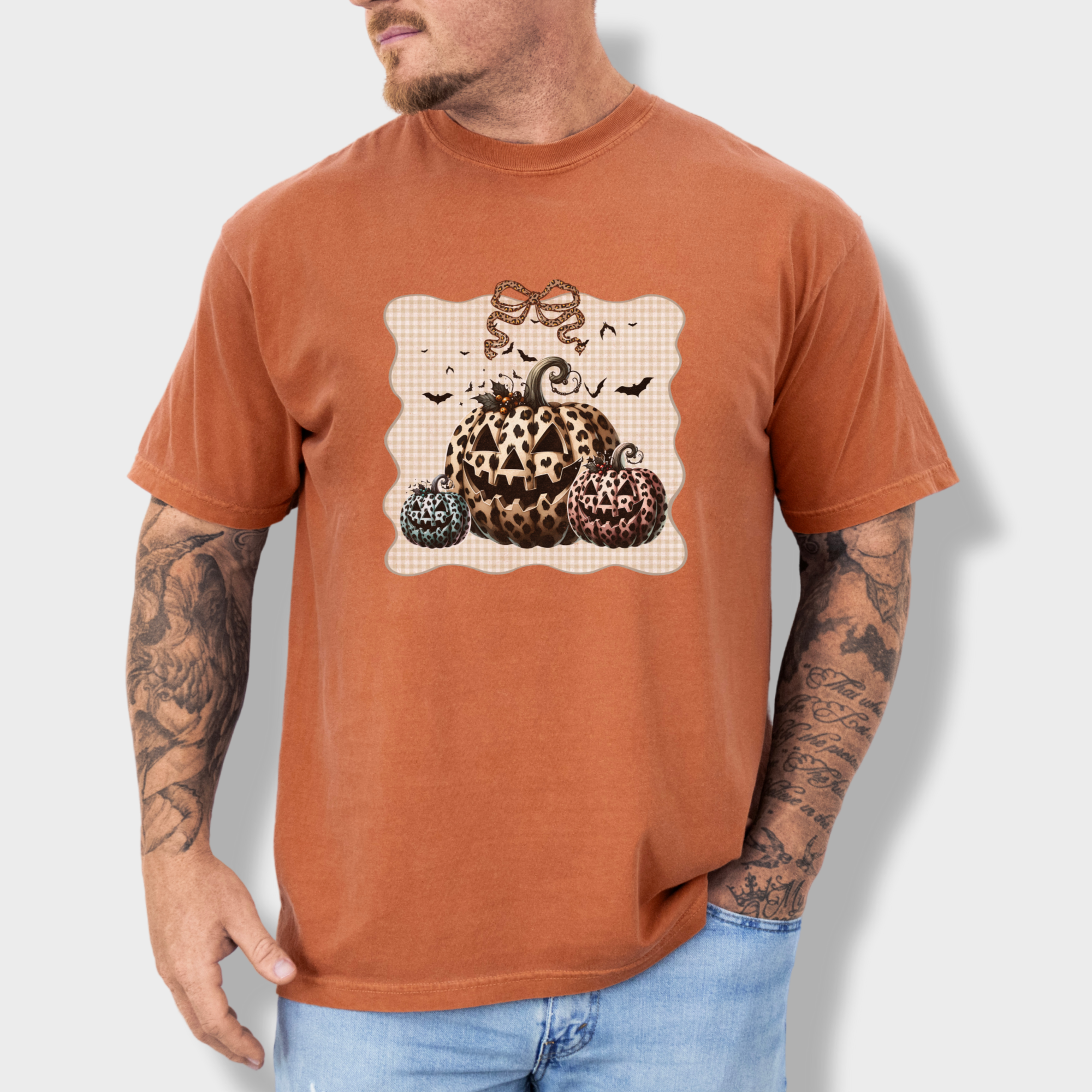western-preppy-leopard-print-jack-o-lanterns-cat-bow-comfort-colors-t-shirt-in-yam - Yam Lifestyle Male Model