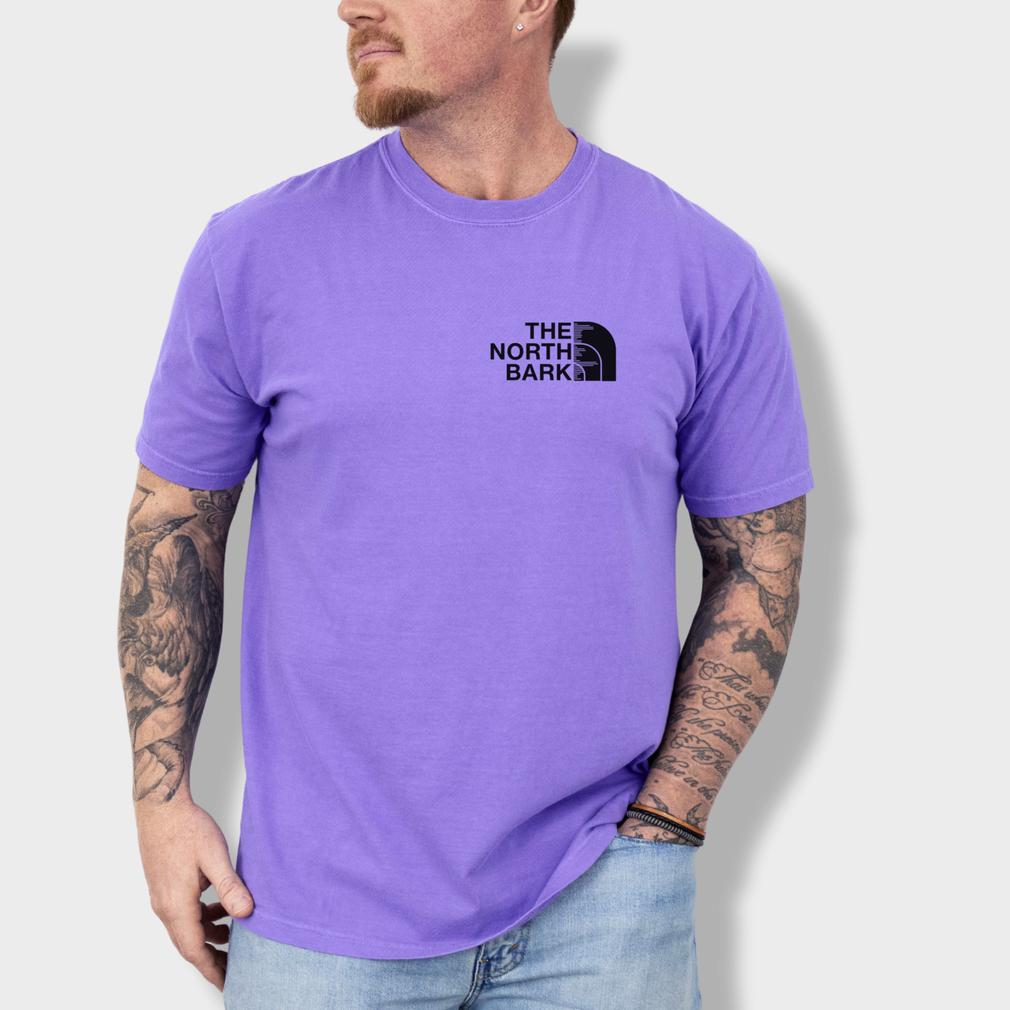 artistic-the-north-bark-dog-graphic-comfort-colors-t-shirt-in-violet - Violet Lifestyle Male Model