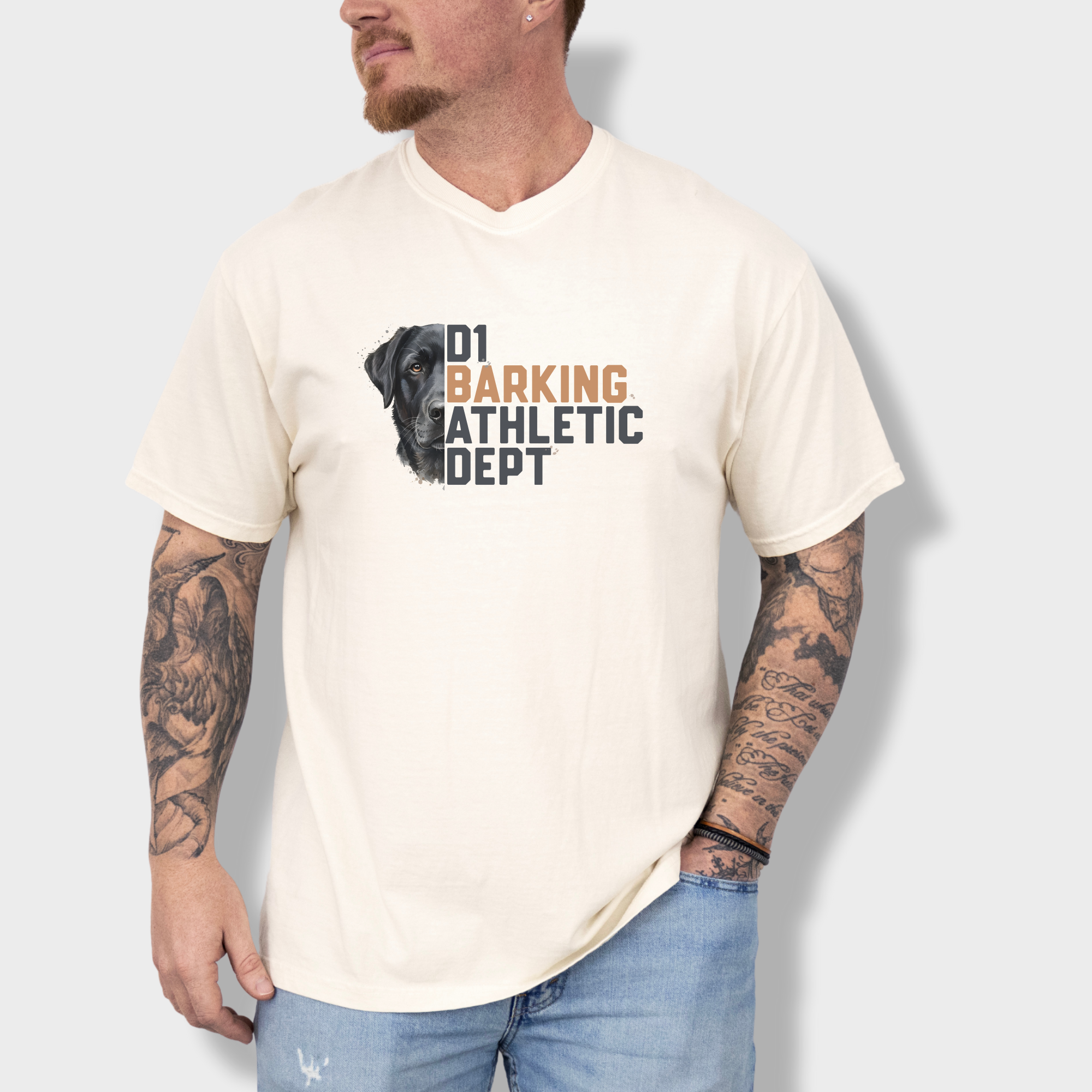 fetch-n-found  unisex tee for men and women featuring , D1 Barking Athletic Department Ivory graphic T-Shirt made of 100% cotton - Ivory Lifestyle Male Model