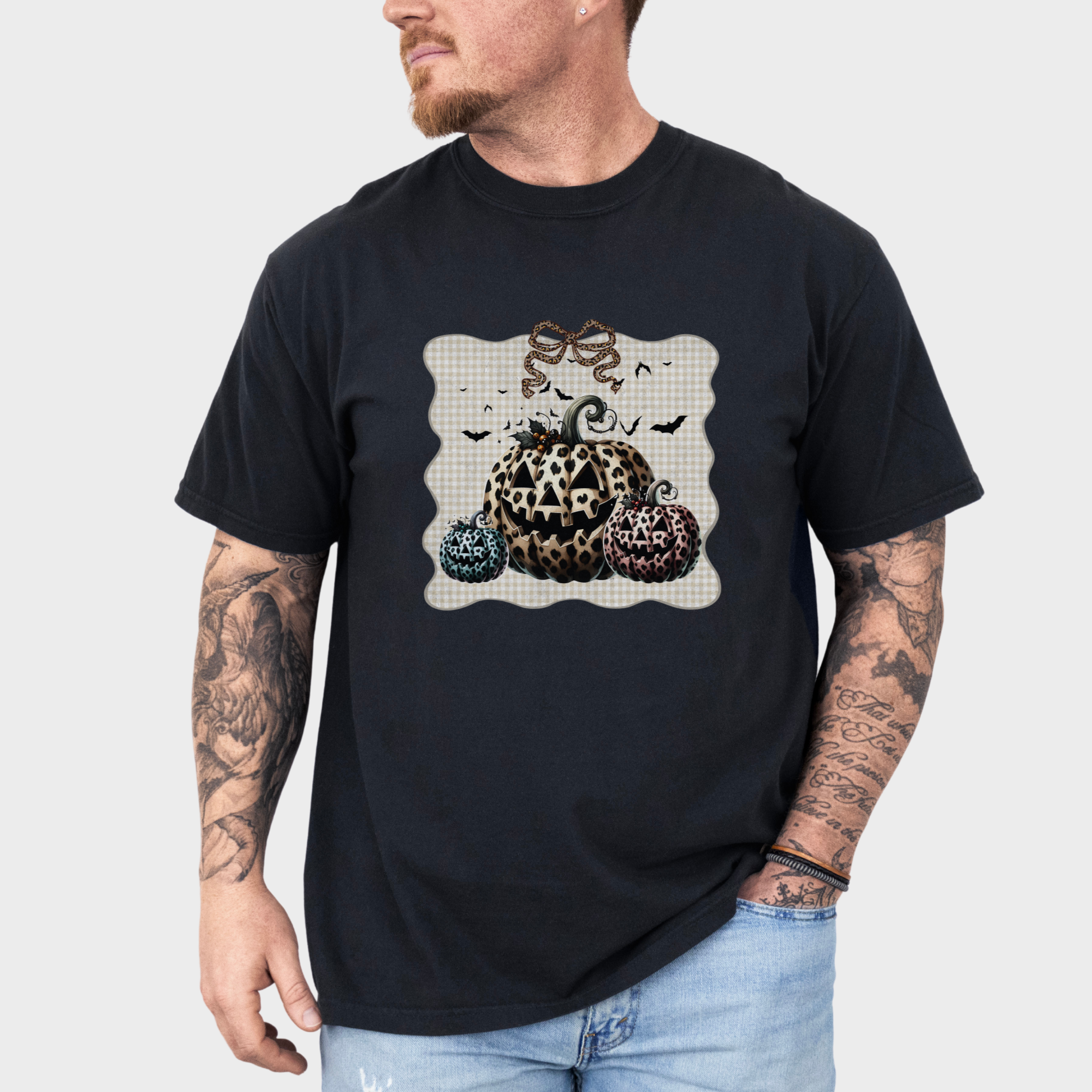 western-preppy-leopard-print-jack-o-lanterns-cat-bow-comfort-colors-t-shirt-in-black - Black Lifestyle Male Model