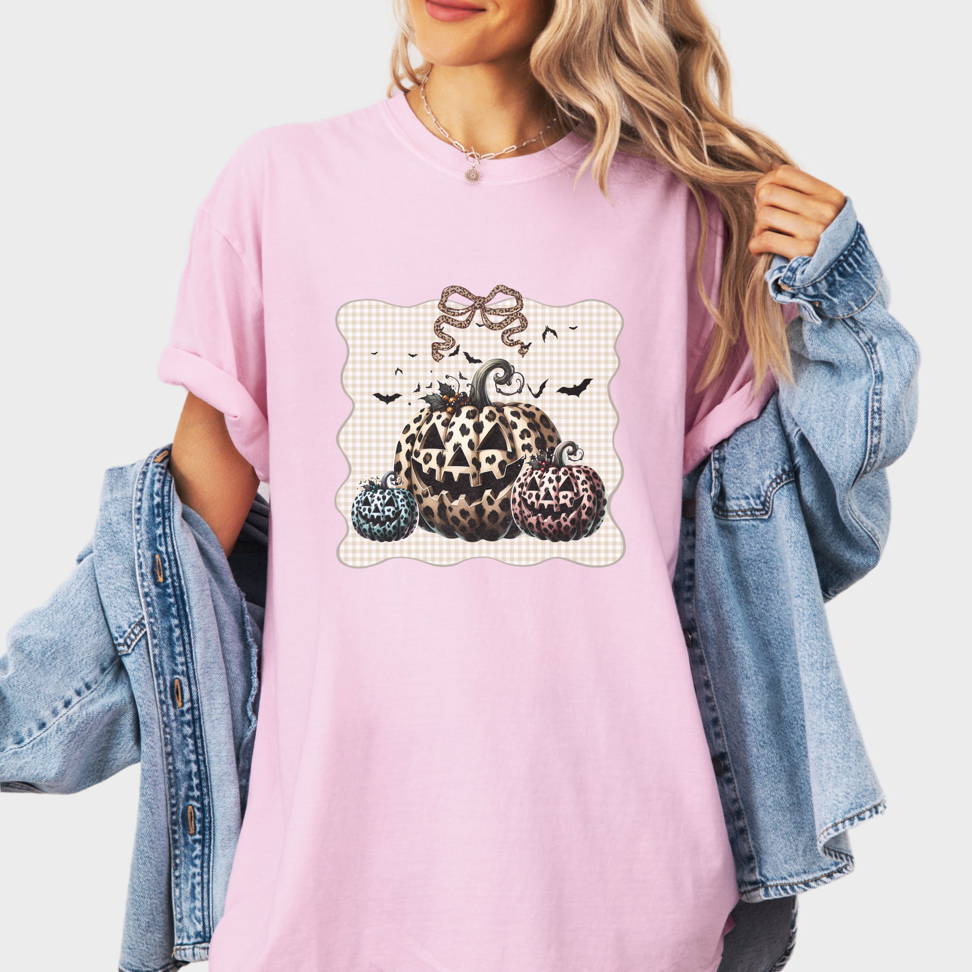 western-preppy-leopard-print-jack-o-lanterns-cat-bow-comfort-colors-t-shirt-in-blossom - Blossom Lifestyle Female Model