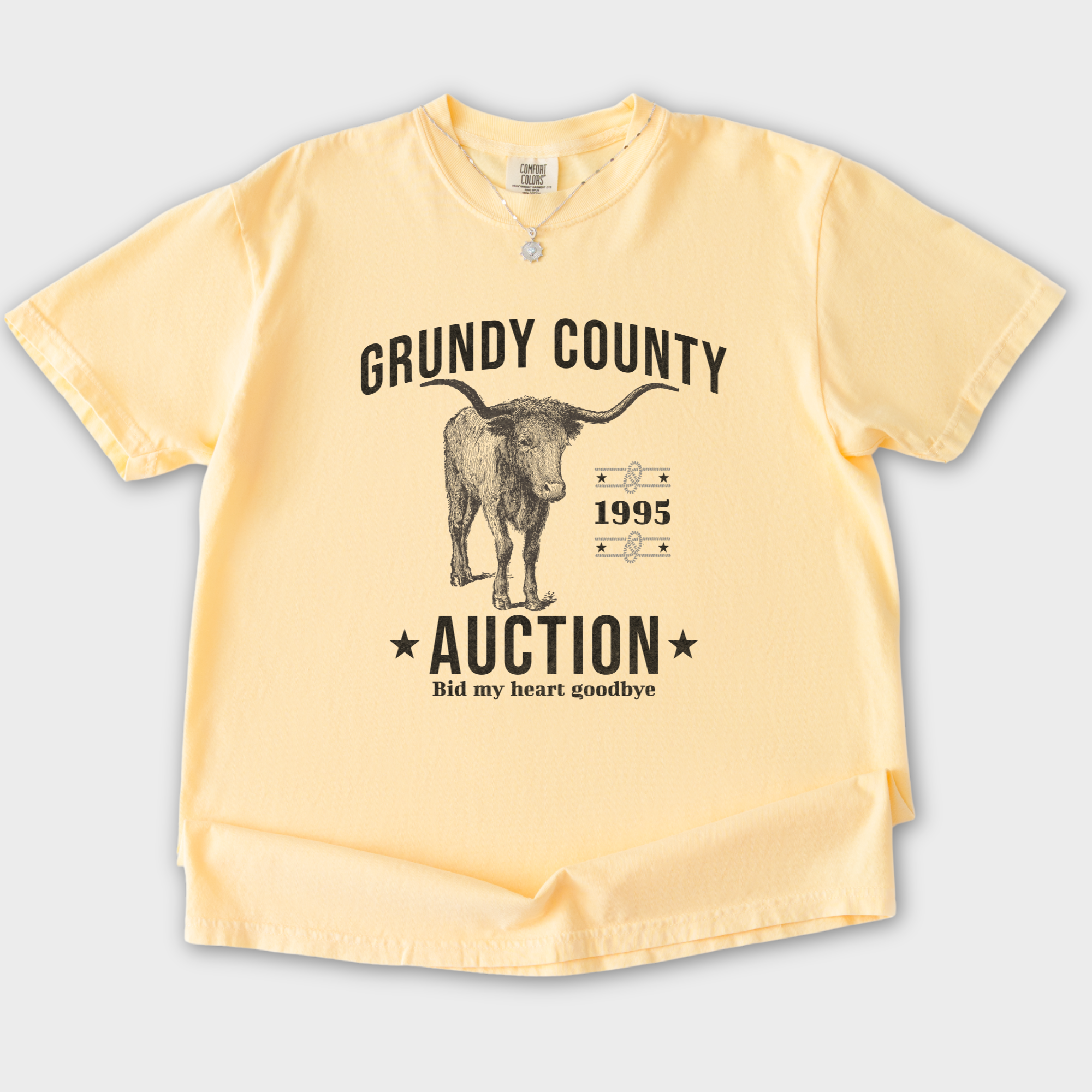 western-grundy-county-auction-animal-line-art-comfort-colors-t-shirt-in-butter - Butter Flat Lay Front