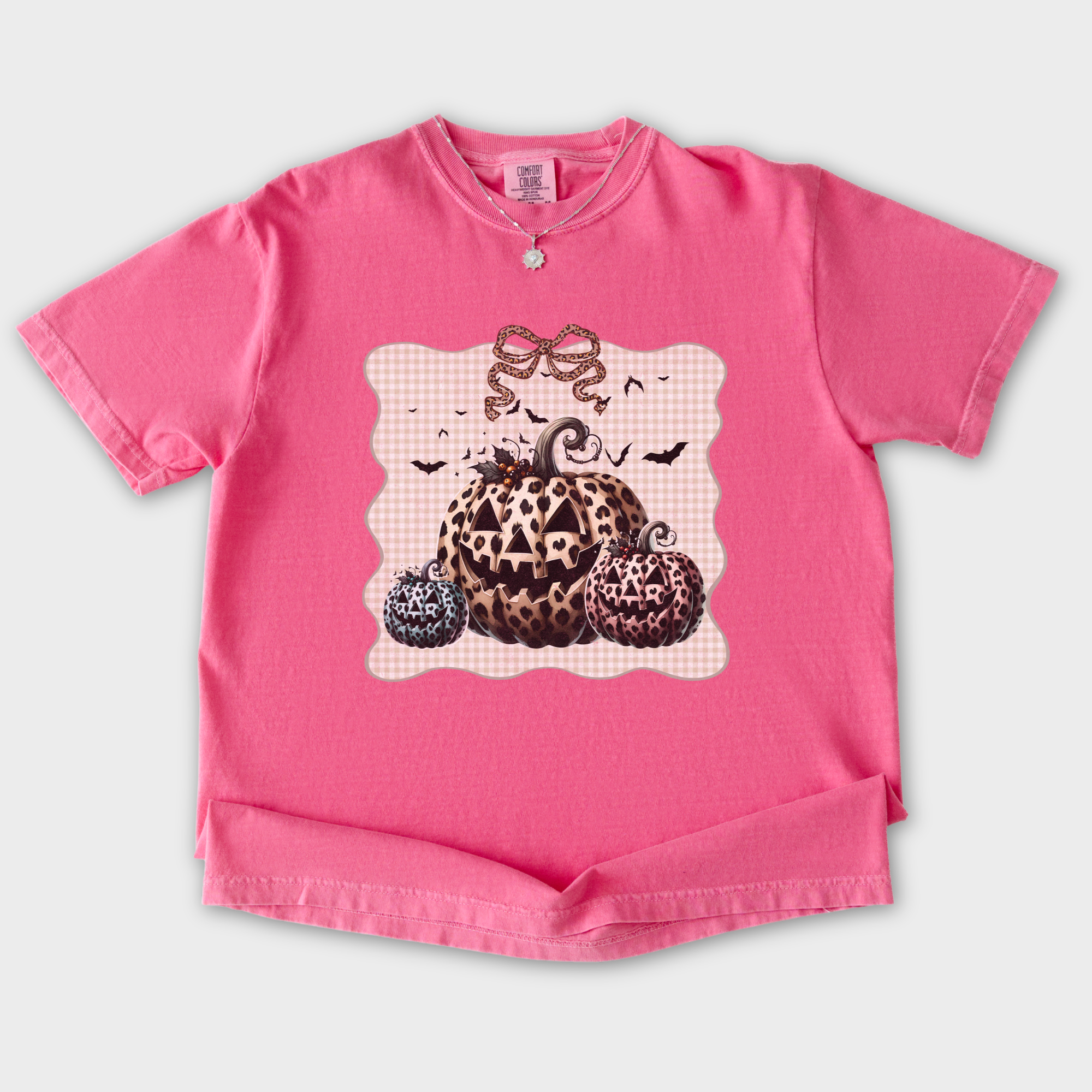 western-preppy-leopard-print-jack-o-lanterns-cat-bow-comfort-colors-t-shirt-in-crunchberry - Crunchberry Flat Lay Front