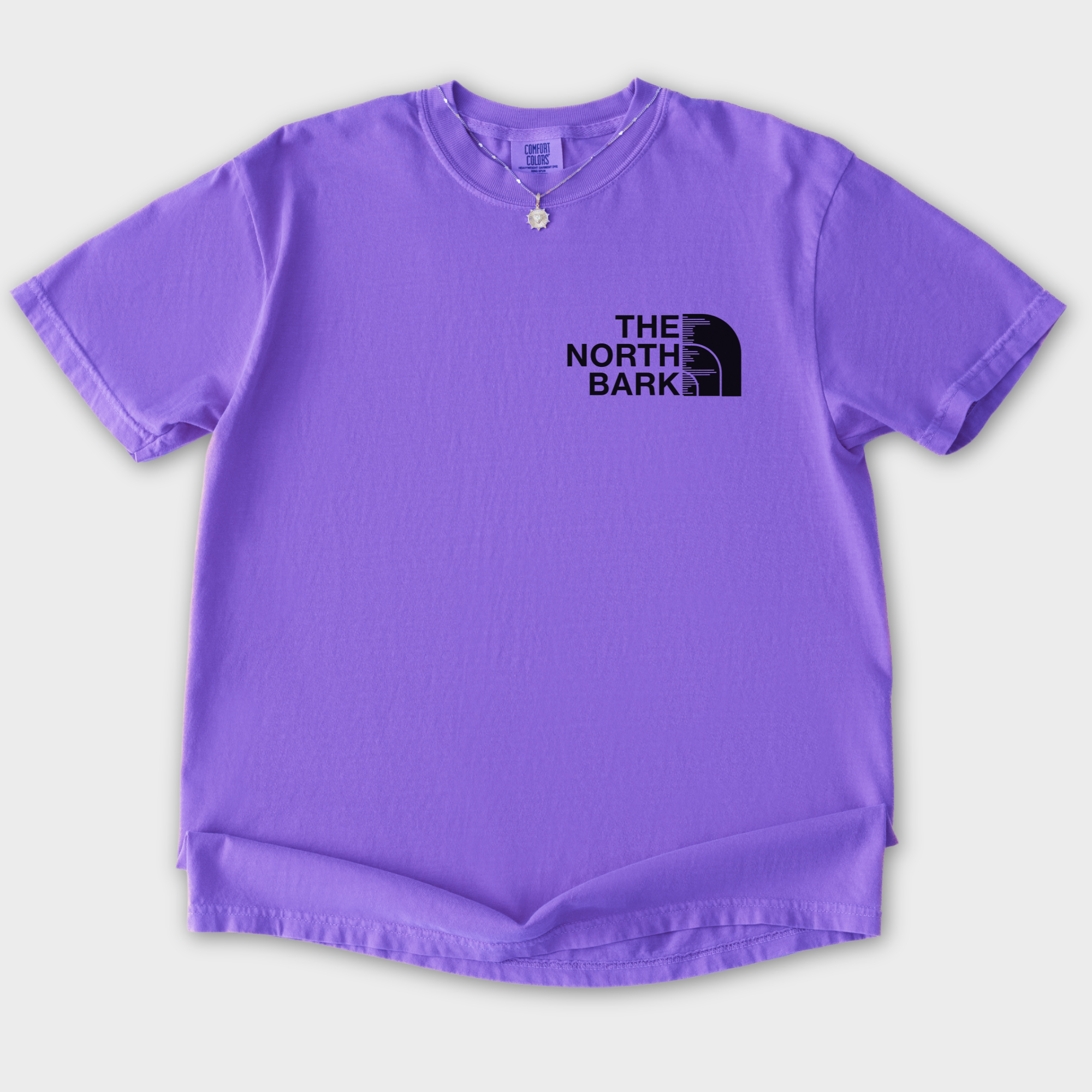 artistic-the-north-bark-dog-graphic-comfort-colors-t-shirt-in-violet - Violet Flat Lay Front