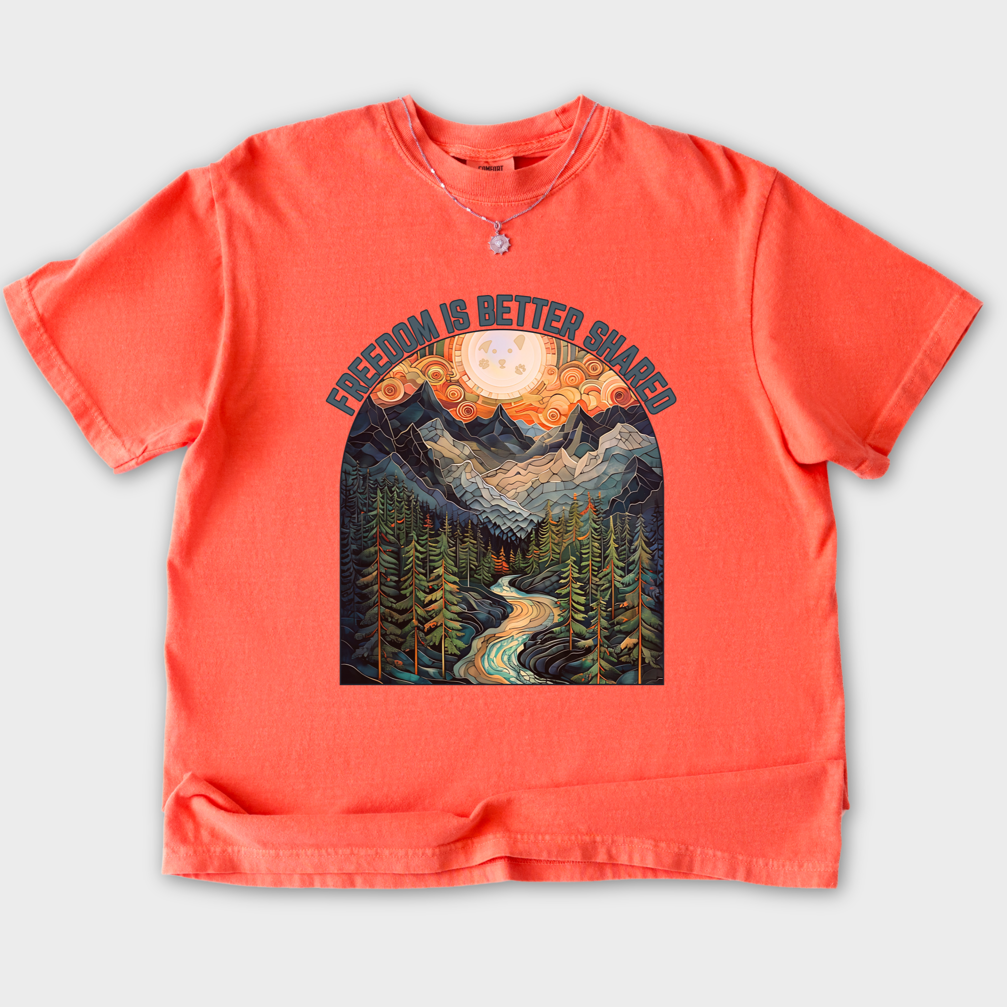artistic-mountain-freedom-is-better-shared-stained-glass-version-dog-graphic-comfort-colors-t-shirt-in-bright-salmon - Bright Salmon Flat Lay Front