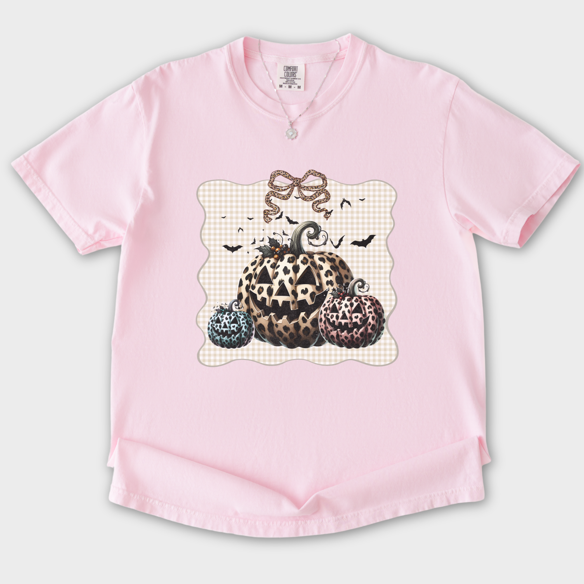 western-preppy-leopard-print-jack-o-lanterns-cat-bow-comfort-colors-t-shirt-in-blossom - Blossom Flat Lay Front