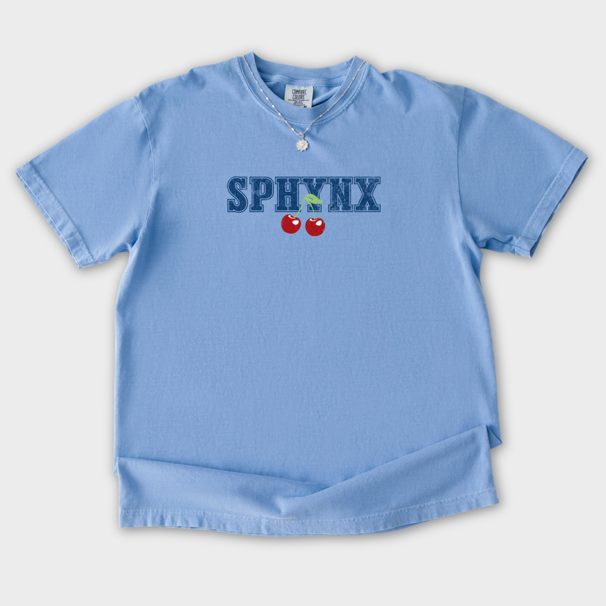 sphynx-cherry-comfort-colors-t-shirt-in-washed-denim - Washed Denim Flat Lay Front