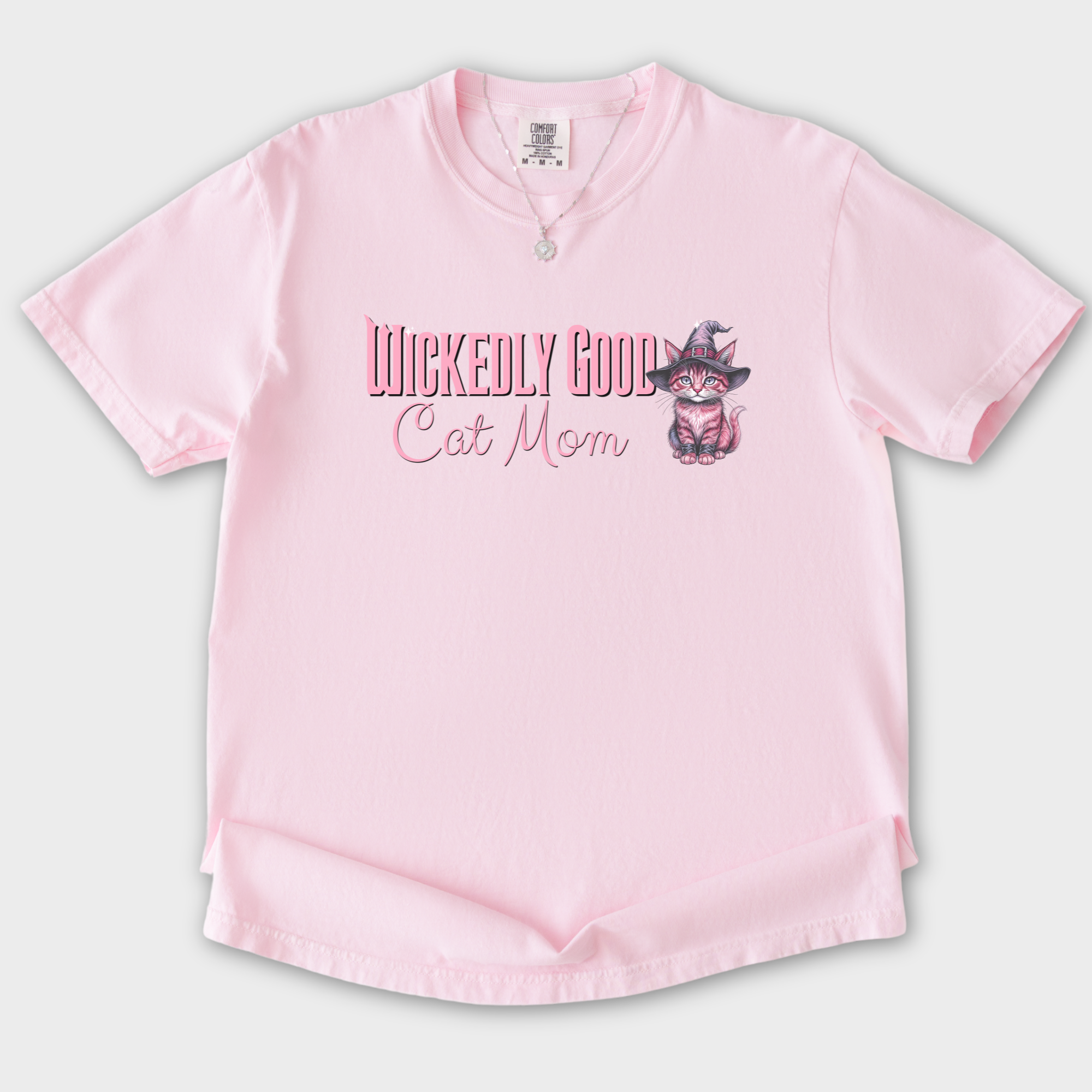 movie-inspired-pink-wickedly-good-cat-mom-cat-graphic-comfort-colors-t-shirt-in-blossom - Blossom Flat Lay Front