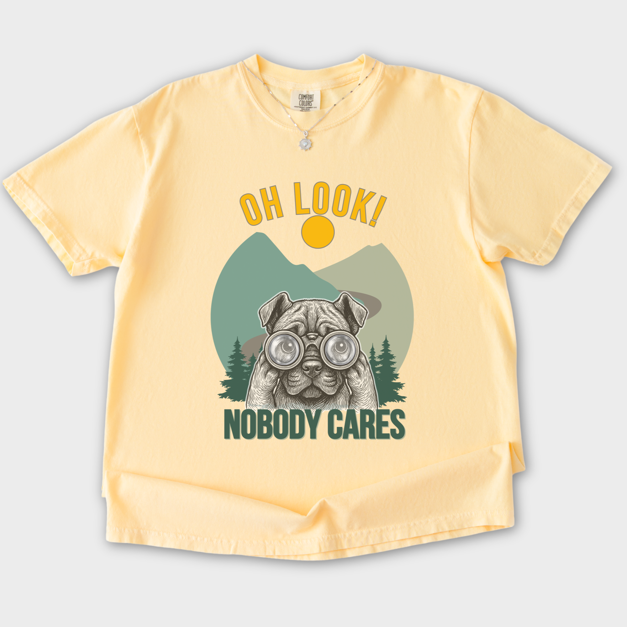 vintage-oh-look-nobody-cares-dog-graphic-comfort-colors-t-shirt-in-butter - Butter Flat Lay Front
