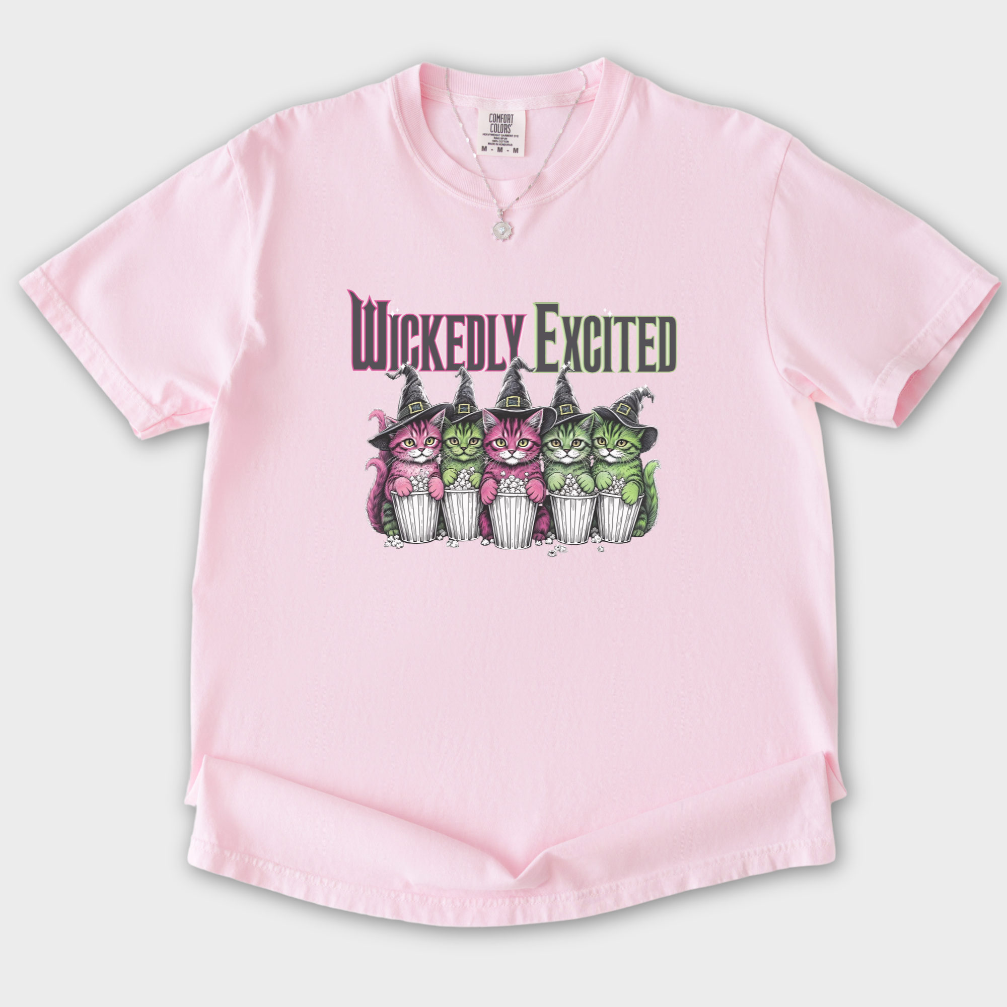 movie-inspired-wickedly-excited-movie-going-kitties-cat-graphic-comfort-colors-t-shirt-in-blossom - Blossom Flat Lay Front