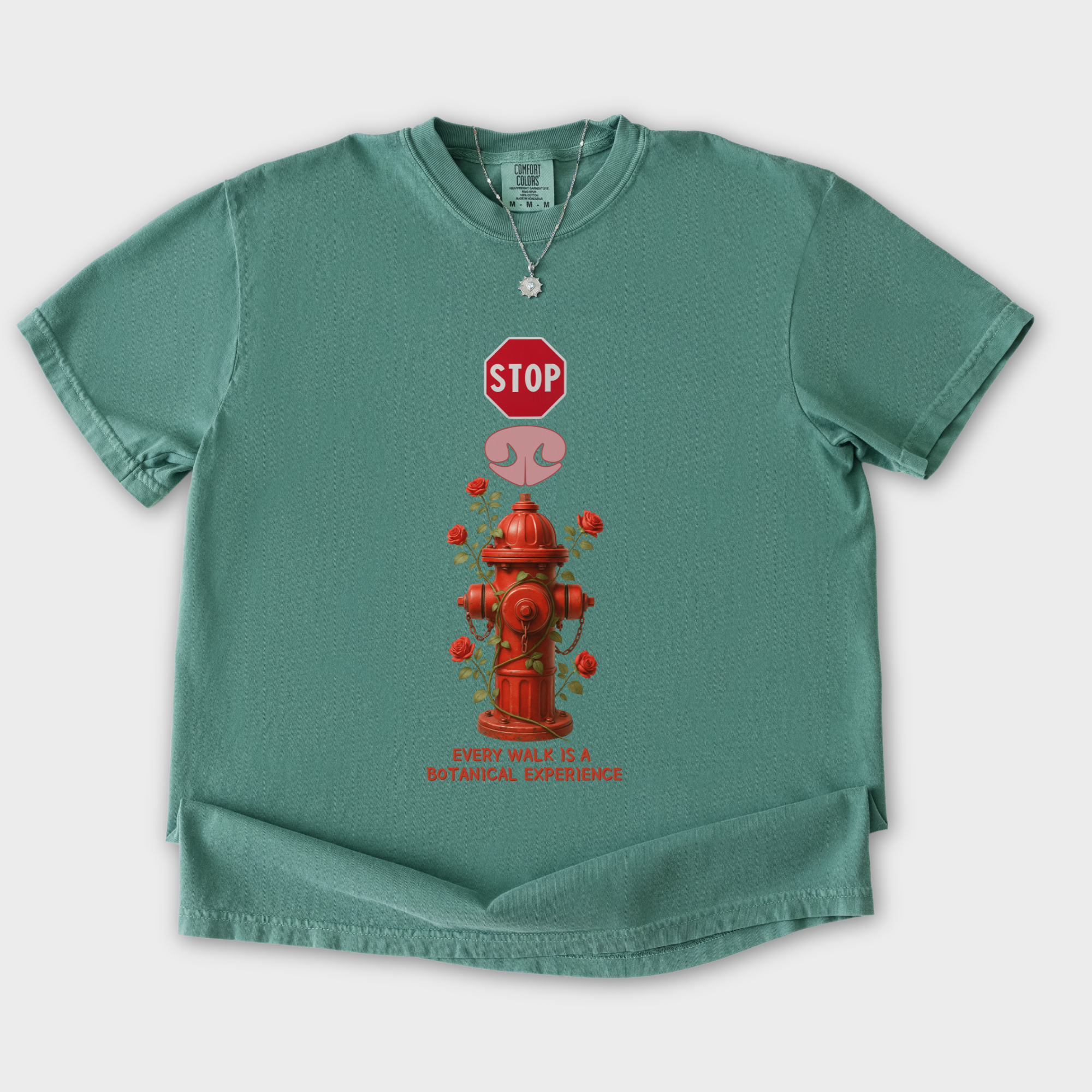floral-every-walk-is-a-botanical-experience-dog-graphic-comfort-colors-t-shirt-in-light-green - Light Green Flat Lay Front