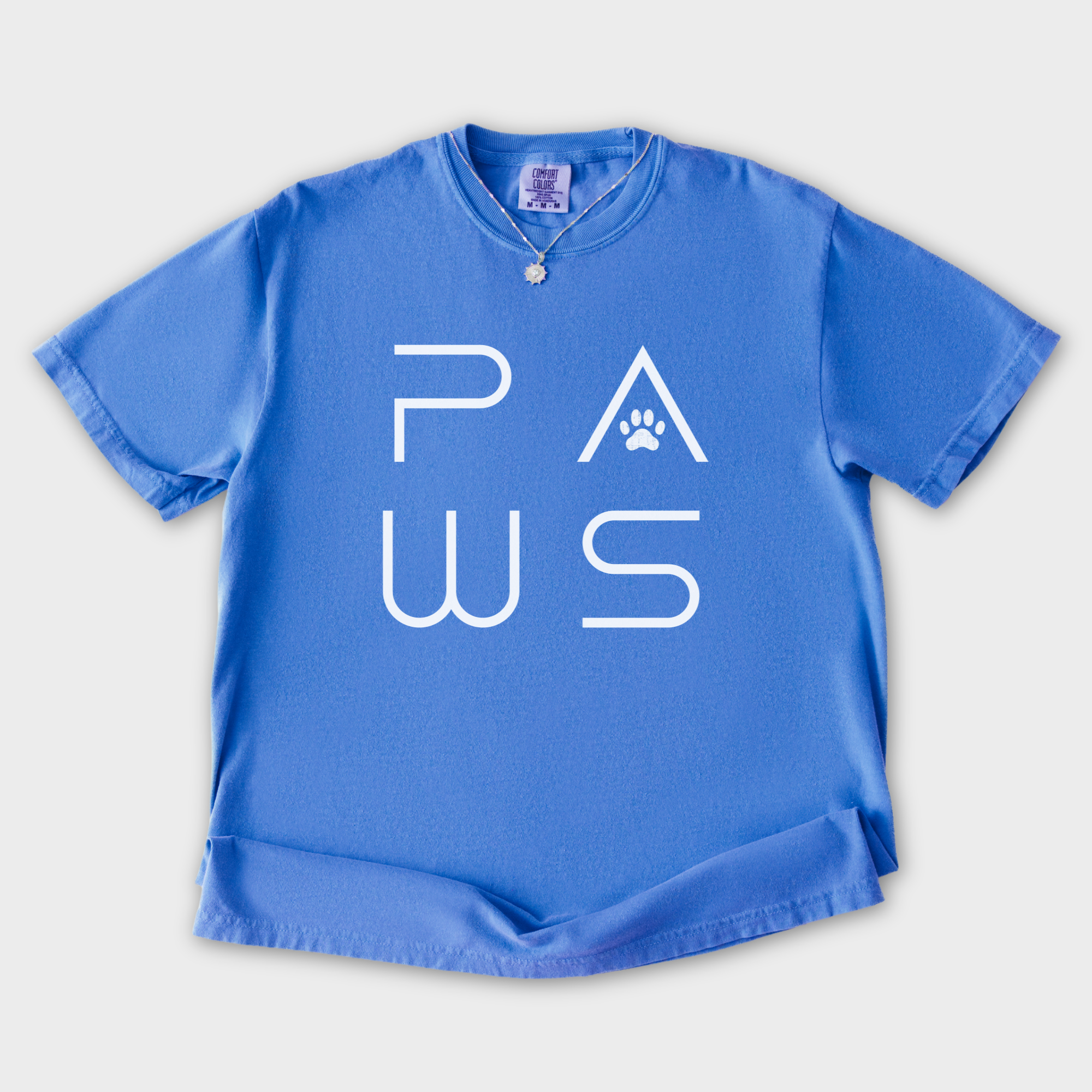 minimalist-paws-modern-text-design-pet-text-comfort-colors-t-shirt-in-flo-blue - Flo Blue Flat Lay Front