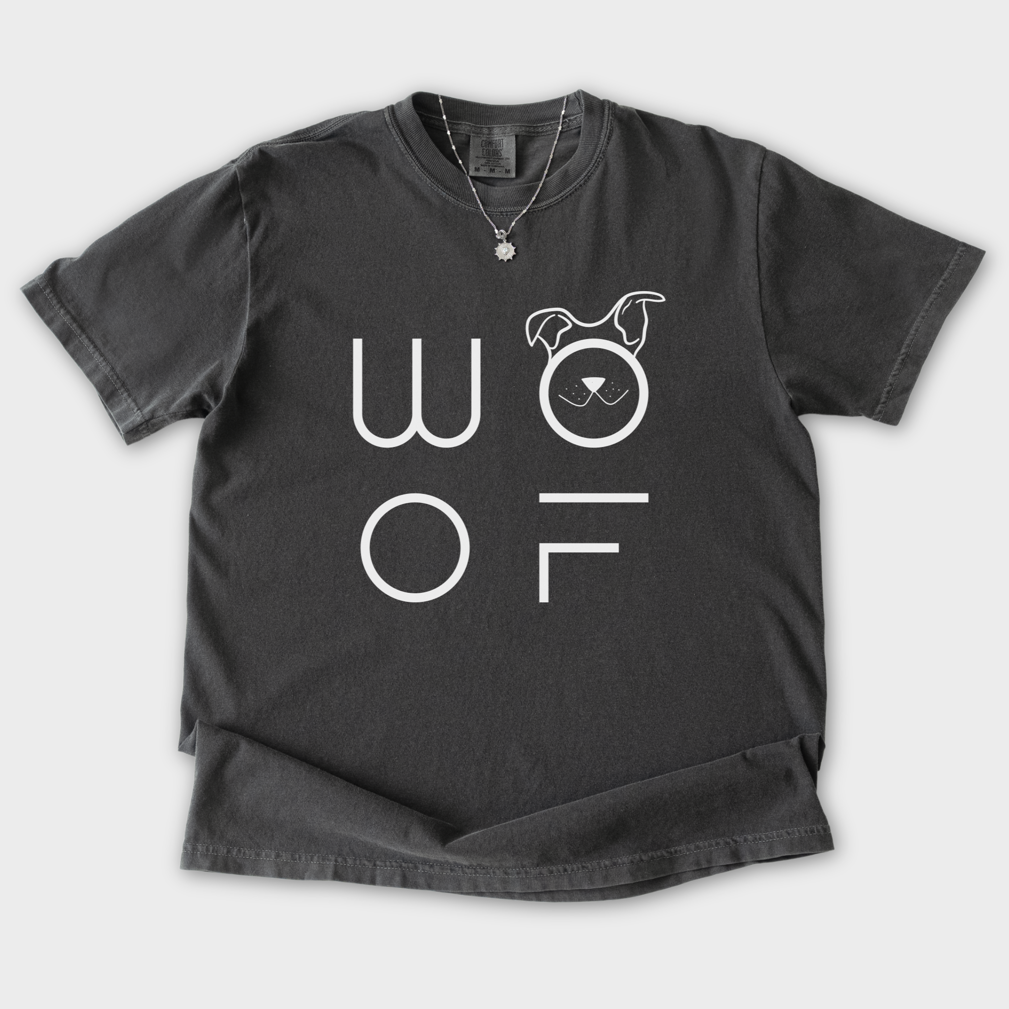 minimalist-woof-modern-text-design-dog-text-comfort-colors-t-shirt-in-pepper - Pepper Flat Lay Front