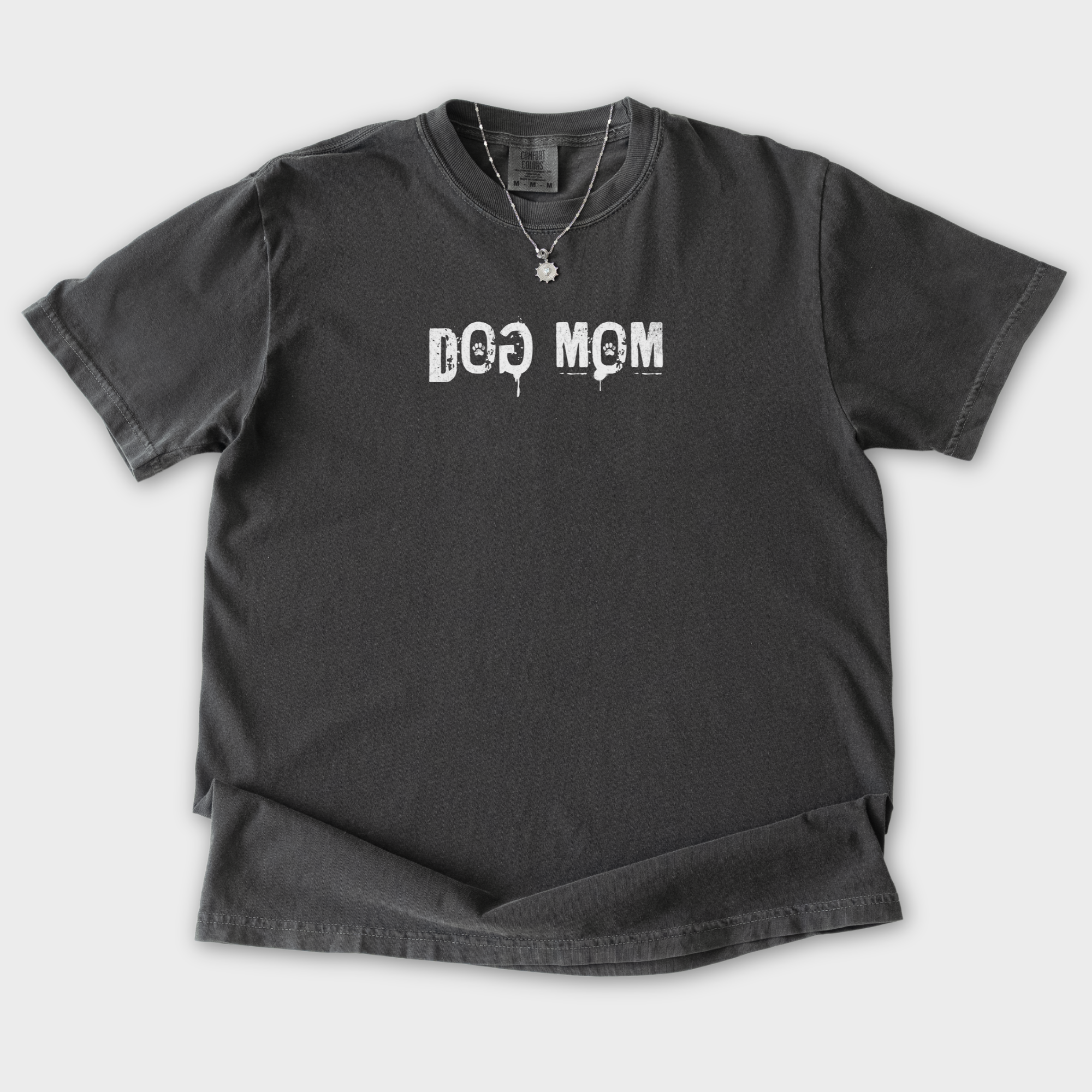 minimalist-dog-mom-messy-stamp-with-paint-splatter-dog-text-comfort-colors-t-shirt-in-pepper - Pepper Flat Lay Front