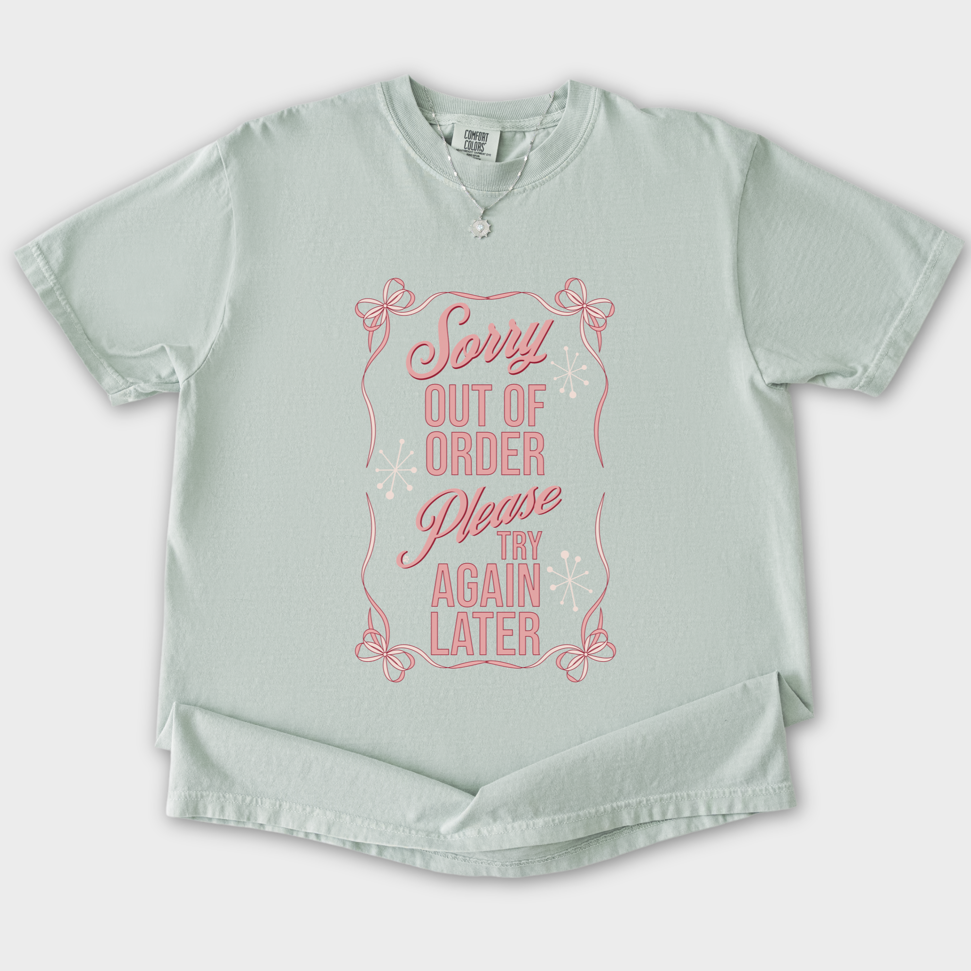 minimalist-sorry-out-of-order-please-try-again-later-feral-bow-comfort-colors-t-shirt-in-bay - Bay Flat Lay Front