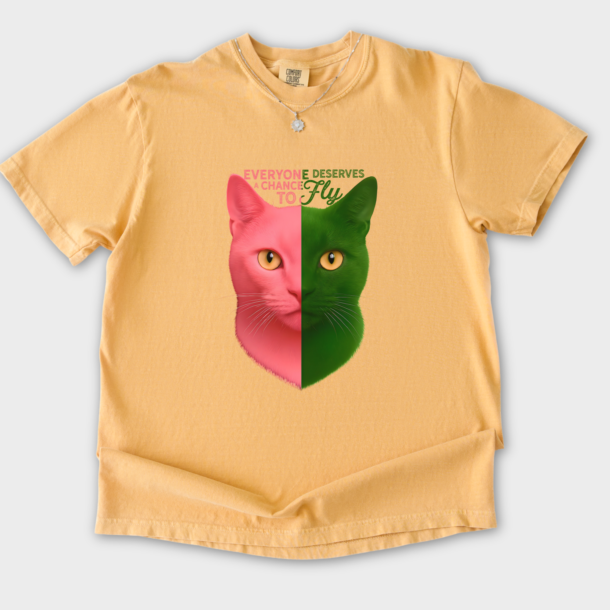 movie-inspired-everyone-deserves-a-chance-to-fly-cat-graphic-comfort-colors-t-shirt-in-mustard - Mustard Flat Lay Front