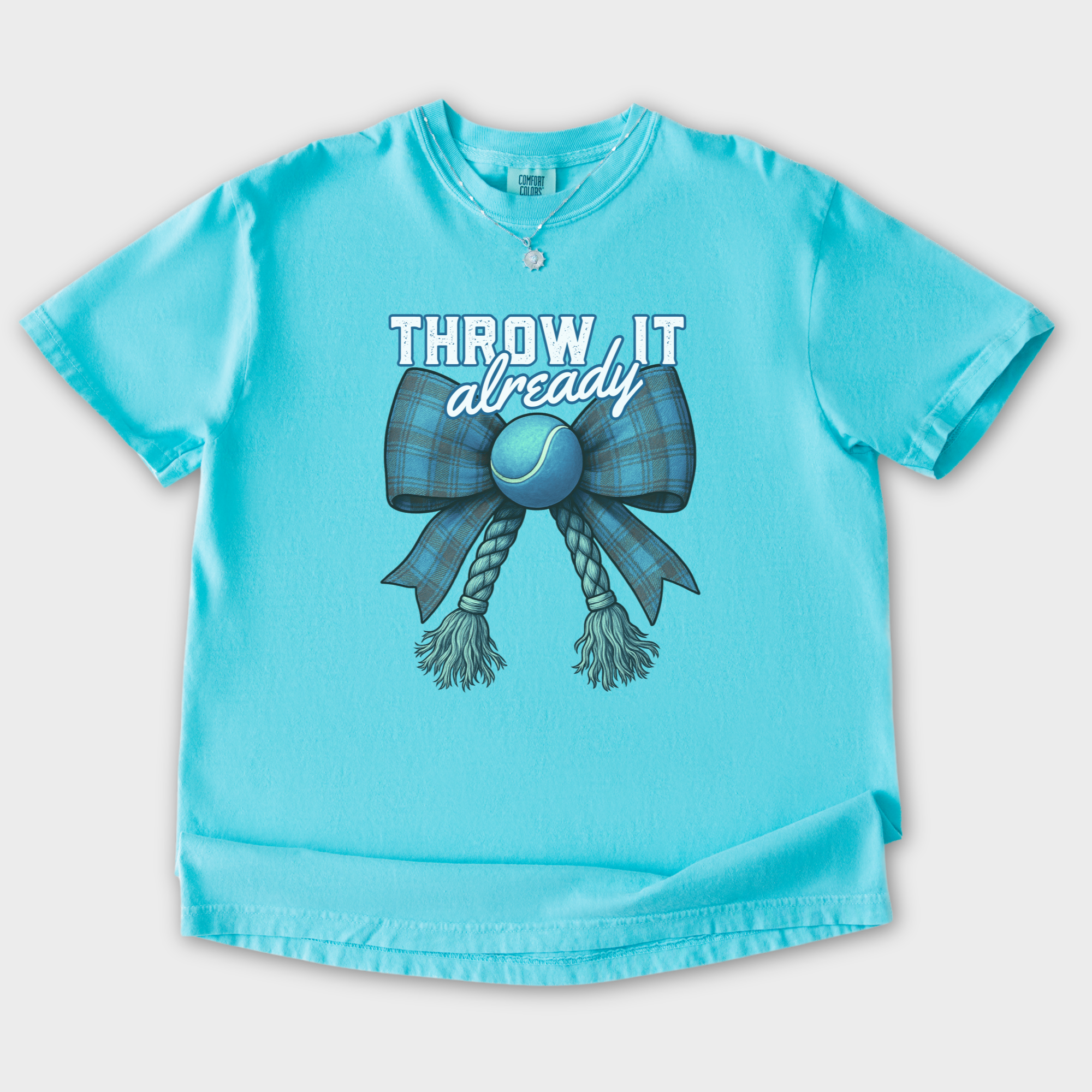 retro-throw-it-already-dog-chew-toy-bow-in-blue-dog-bow-comfort-colors-t-shirt-in-lagoon-blue - Lagoon Blue Flat Lay Front