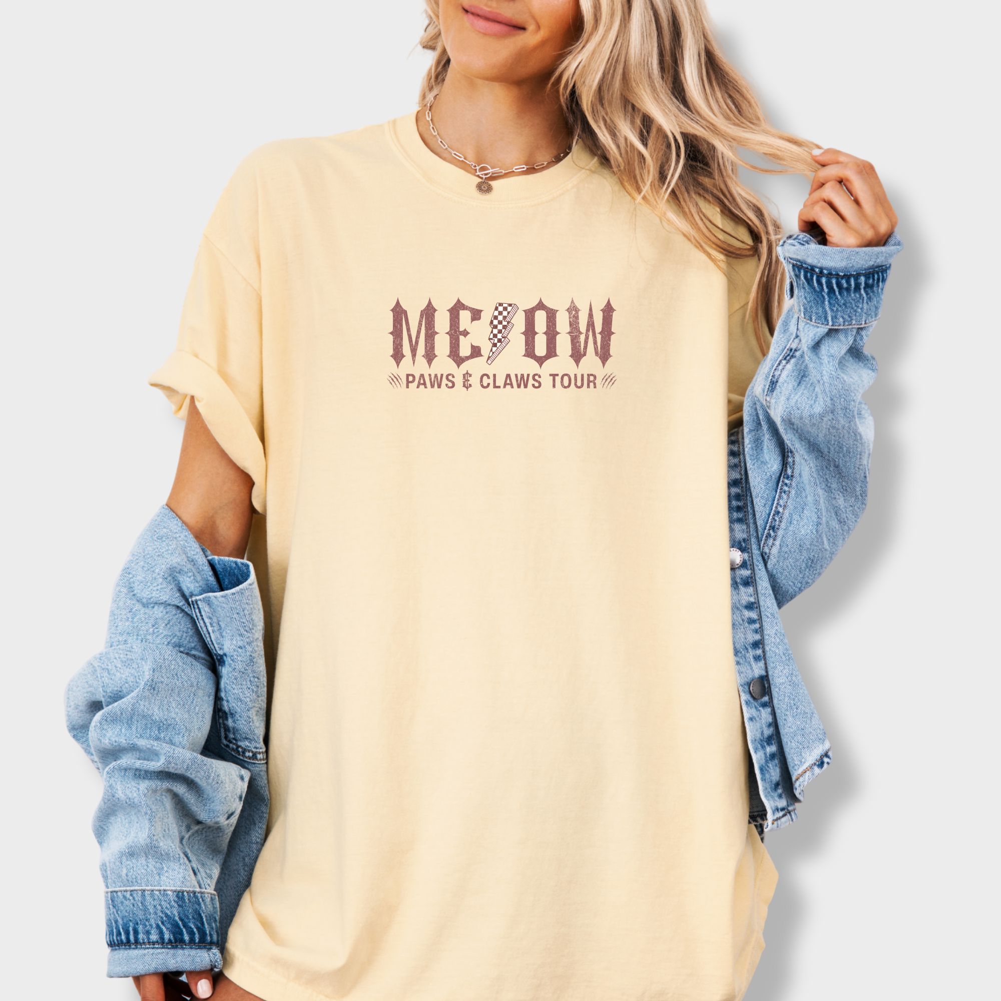 retro-meow-paws-and-claws-tour-cat-graphic-comfort-colors-t-shirt-in-butter - Butter Lifestyle Female Model