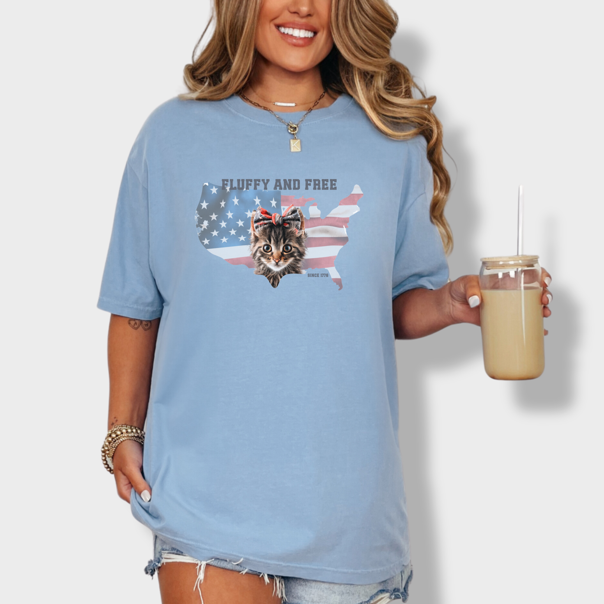 retro-fluffy-and-free-fourth-of-july-kitty-cat-graphic-comfort-colors-t-shirt-in-washed-denim - Washed Denim Lifestyle Female Model