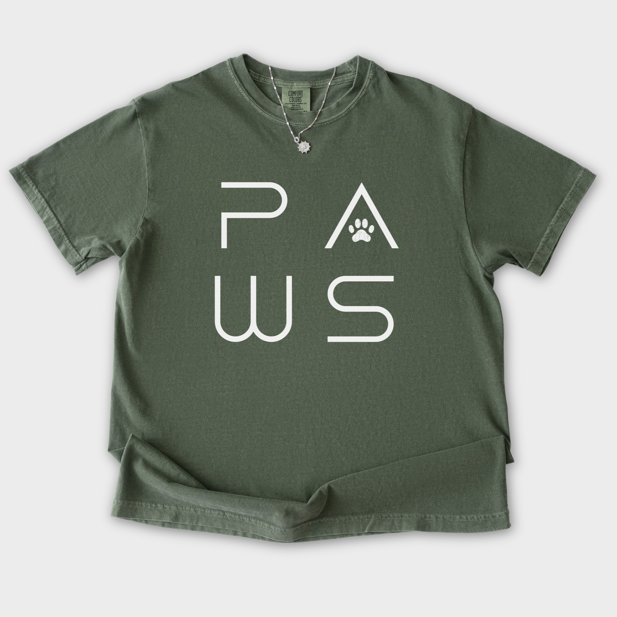 minimalist-paws-modern-text-design-pet-text-comfort-colors-t-shirt-in-moss - Moss Flat Lay Front
