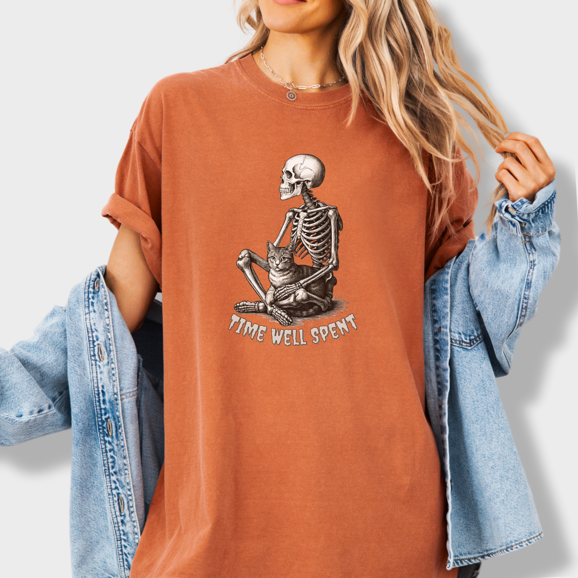 line-art-sit-still-skeleton-petting-cat-cat-skeleton-comfort-colors-t-shirt-in-yam - Yam Lifestyle Female Model