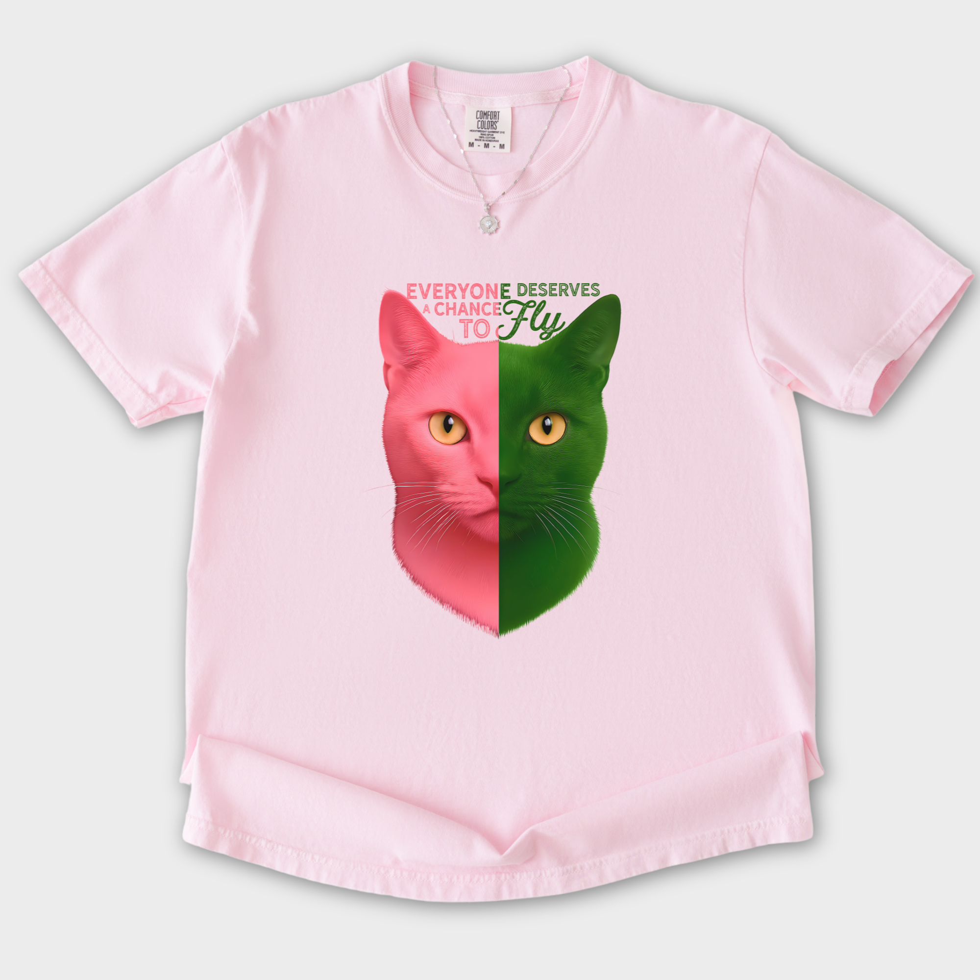 movie-inspired-everyone-deserves-a-chance-to-fly-cat-graphic-comfort-colors-t-shirt-in-blossom - Blossom Flat Lay Front