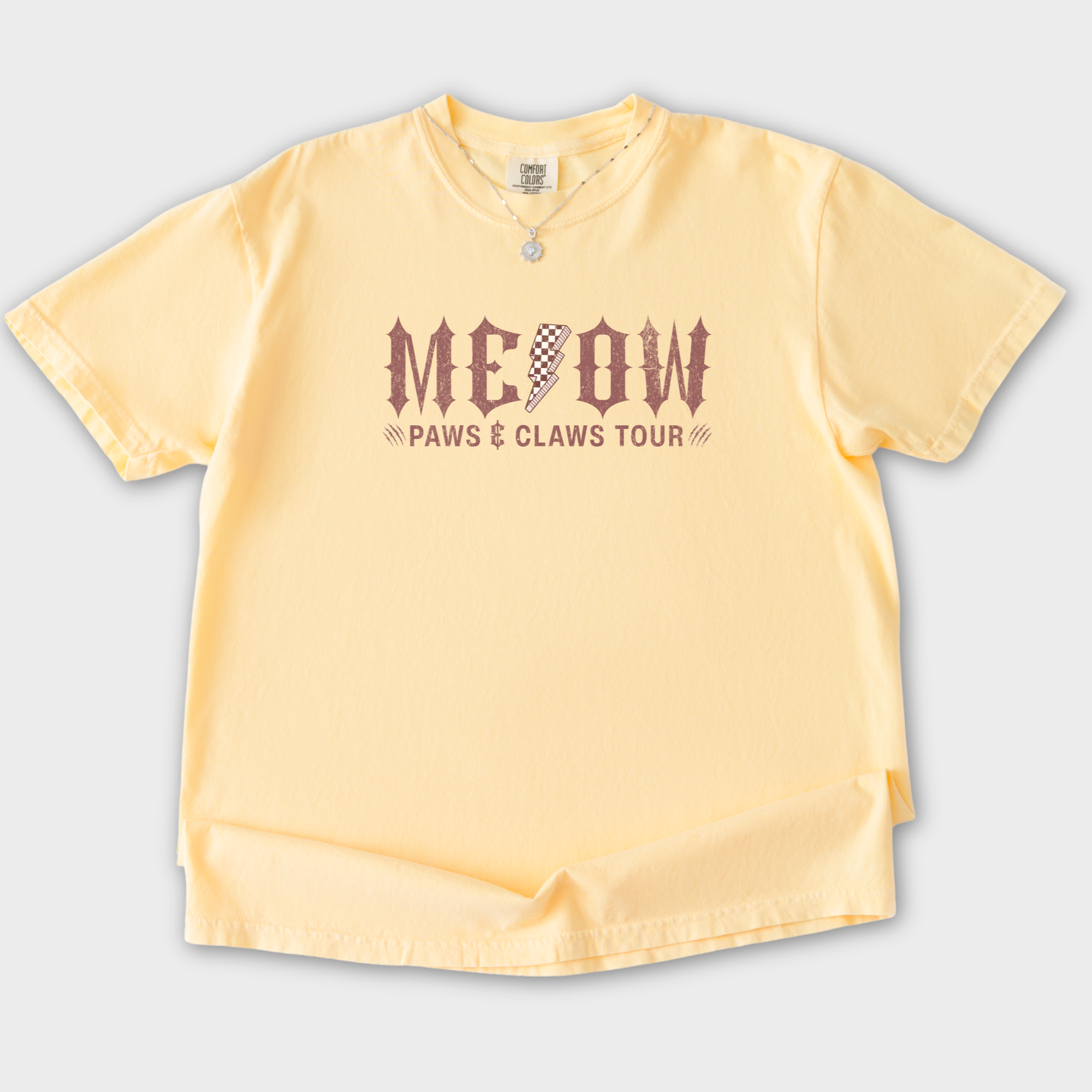 retro-meow-paws-and-claws-tour-cat-graphic-comfort-colors-t-shirt-in-butter - Butter Flat Lay Front