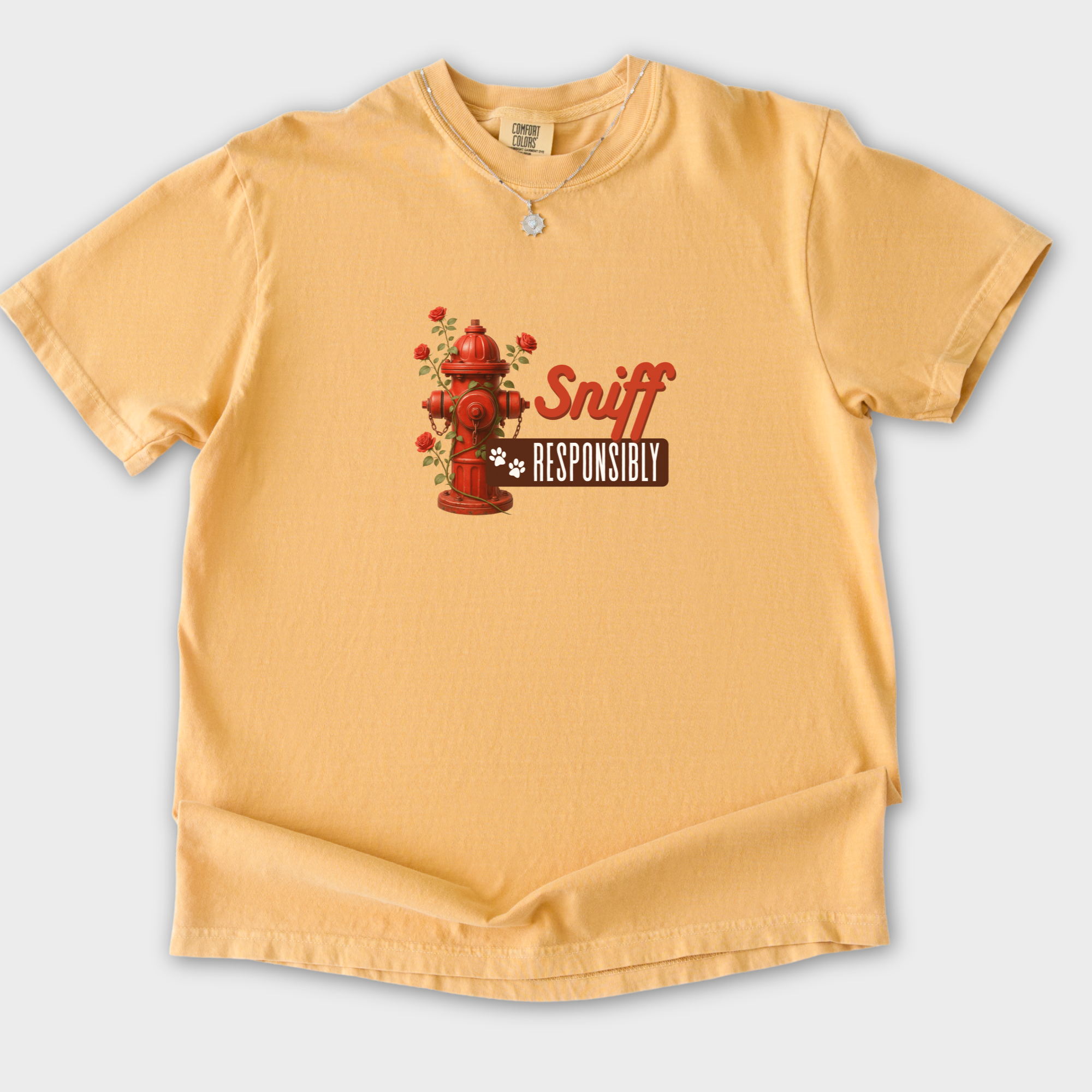 floral-sniff-responsibly-dog-graphic-comfort-colors-t-shirt-in-mustard - Mustard Flat Lay Front