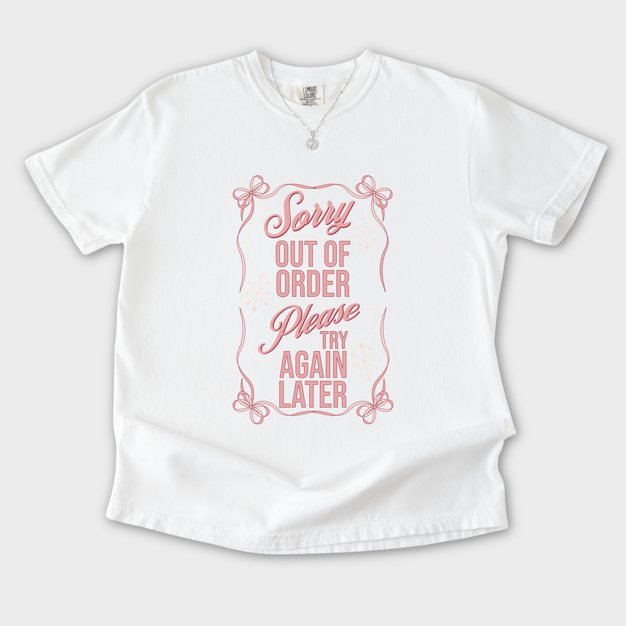 minimalist-sorry-out-of-order-please-try-again-later-feral-bow-comfort-colors-t-shirt-in-white - White Flat Lay Front