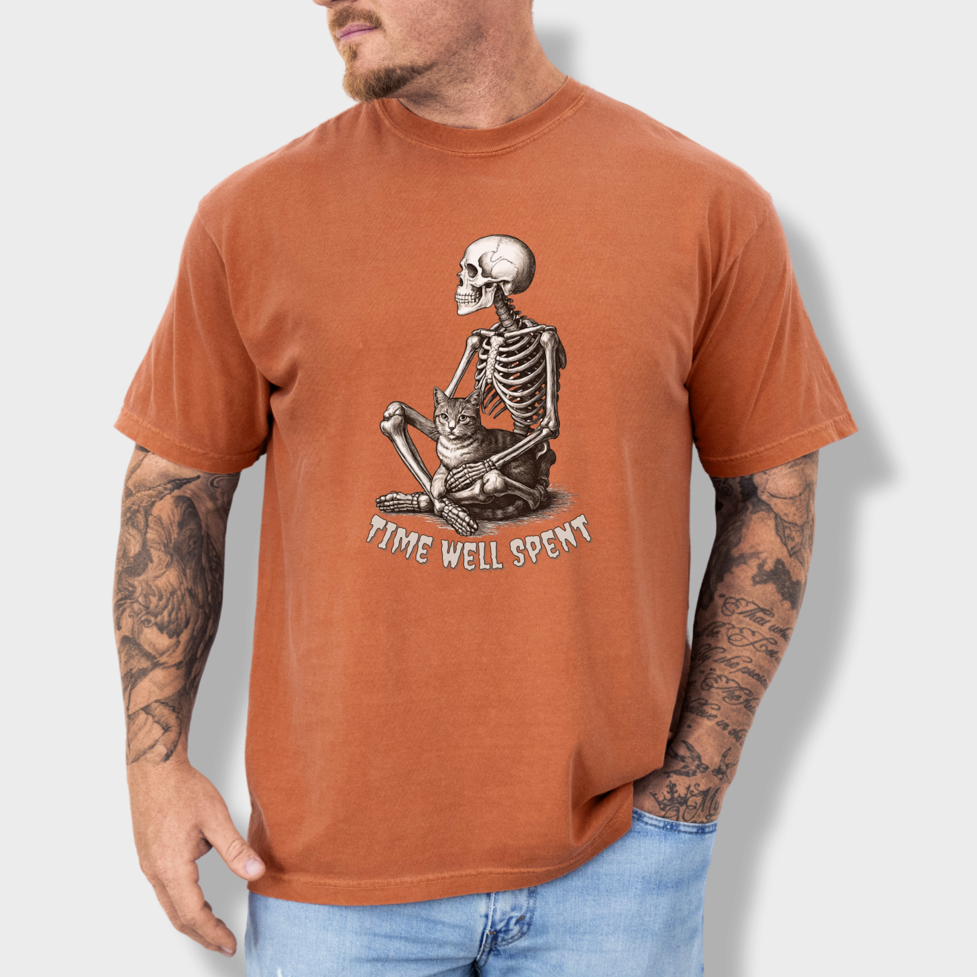 line-art-sit-still-skeleton-petting-cat-cat-skeleton-comfort-colors-t-shirt-in-yam - Yam Lifestyle Male Model