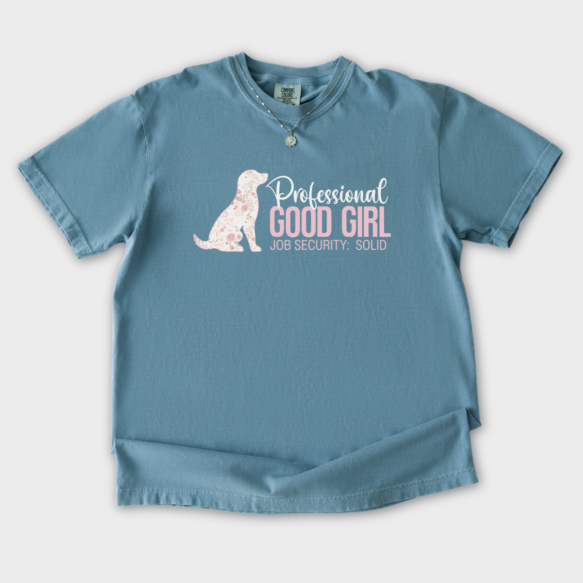 floral-professional-good-girl-solid-job-security-dog-graphic-comfort-colors-t-shirt-in-ice-blue - Ice Blue Flat Lay Front