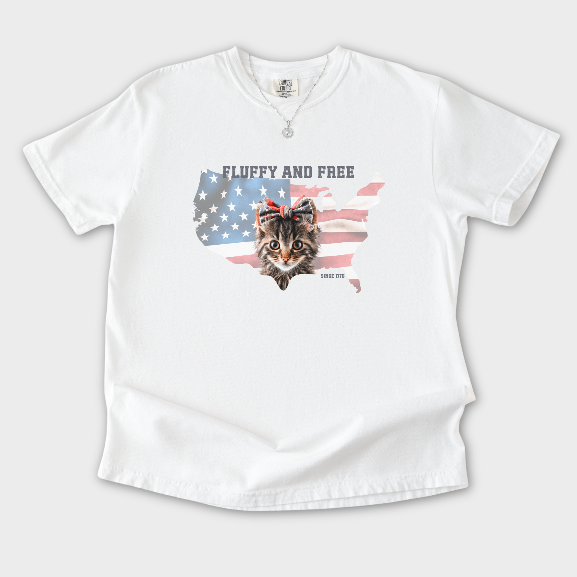 retro-fluffy-and-free-fourth-of-july-kitty-cat-graphic-comfort-colors-t-shirt-in-white - White Flat Lay Front