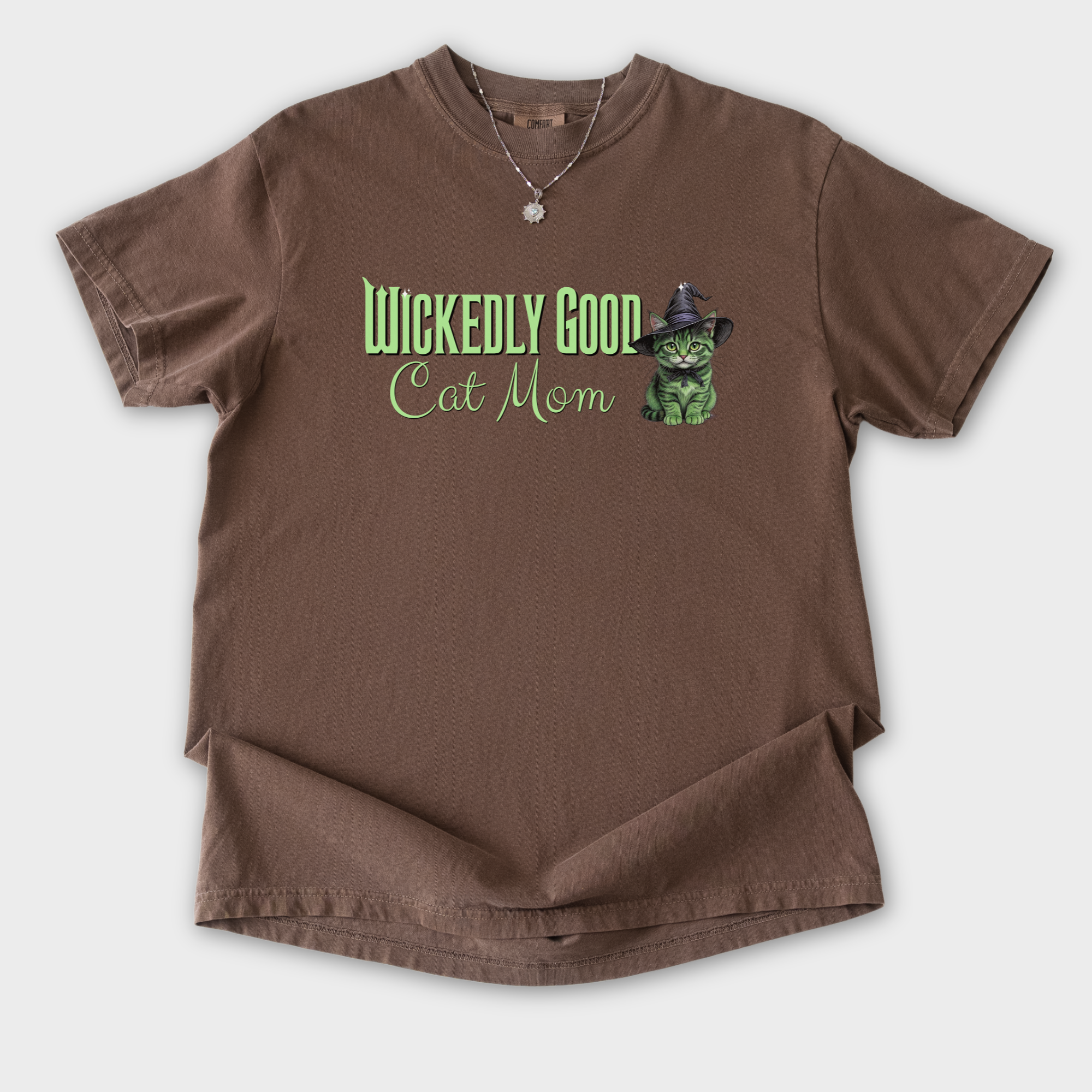 movie-inspired-green-wickedly-good-cat-mom-cat-graphic-comfort-colors-t-shirt-in-espresso - Espresso Flat Lay Front