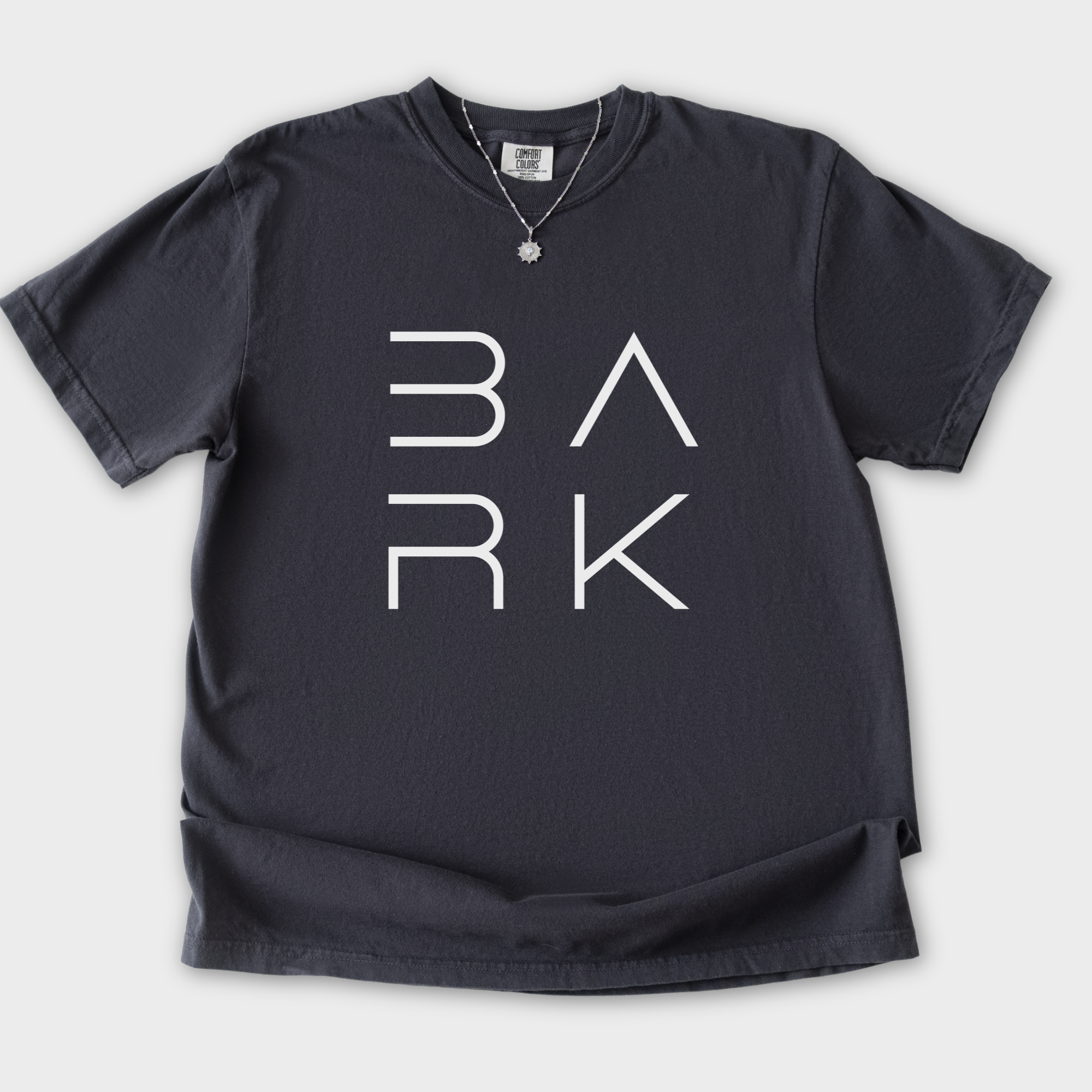minimalist-bark-modern-text-design-dog-text-comfort-colors-t-shirt-in-graphite - Graphite Flat Lay Front