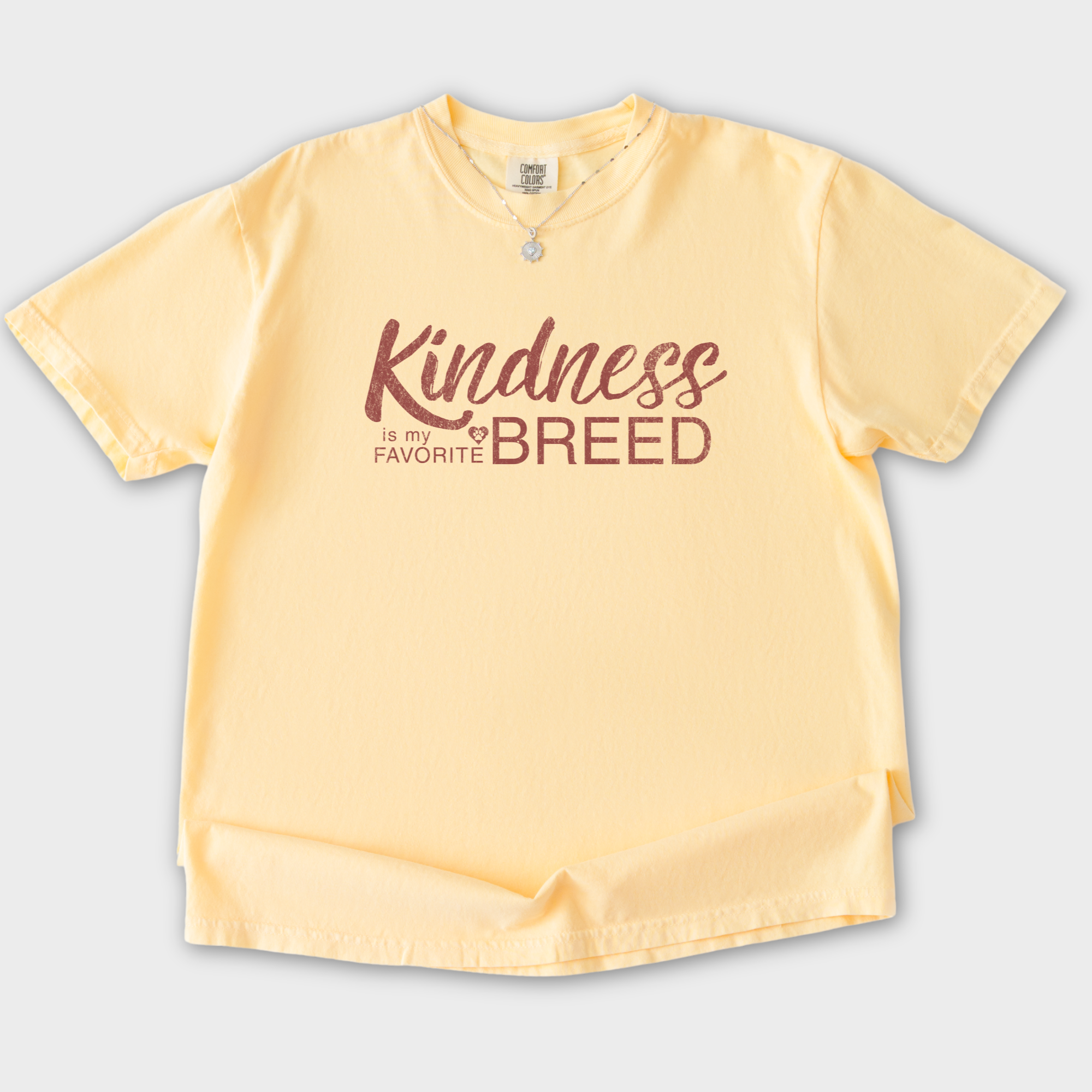 vintage-kindness-is-my-favorite-breed-dog-text-comfort-colors-t-shirt-in-butter - Butter Flat Lay Front