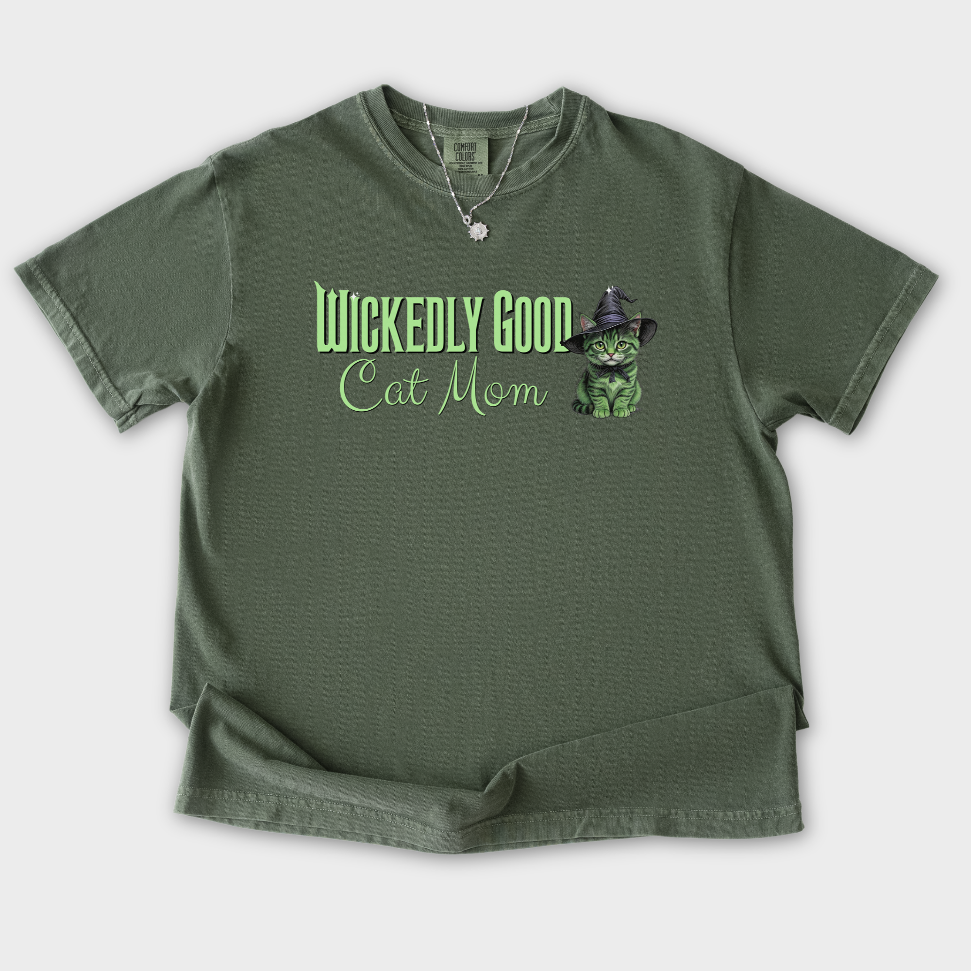 movie-inspired-green-wickedly-good-cat-mom-cat-graphic-comfort-colors-t-shirt-in-moss - Moss Flat Lay Front