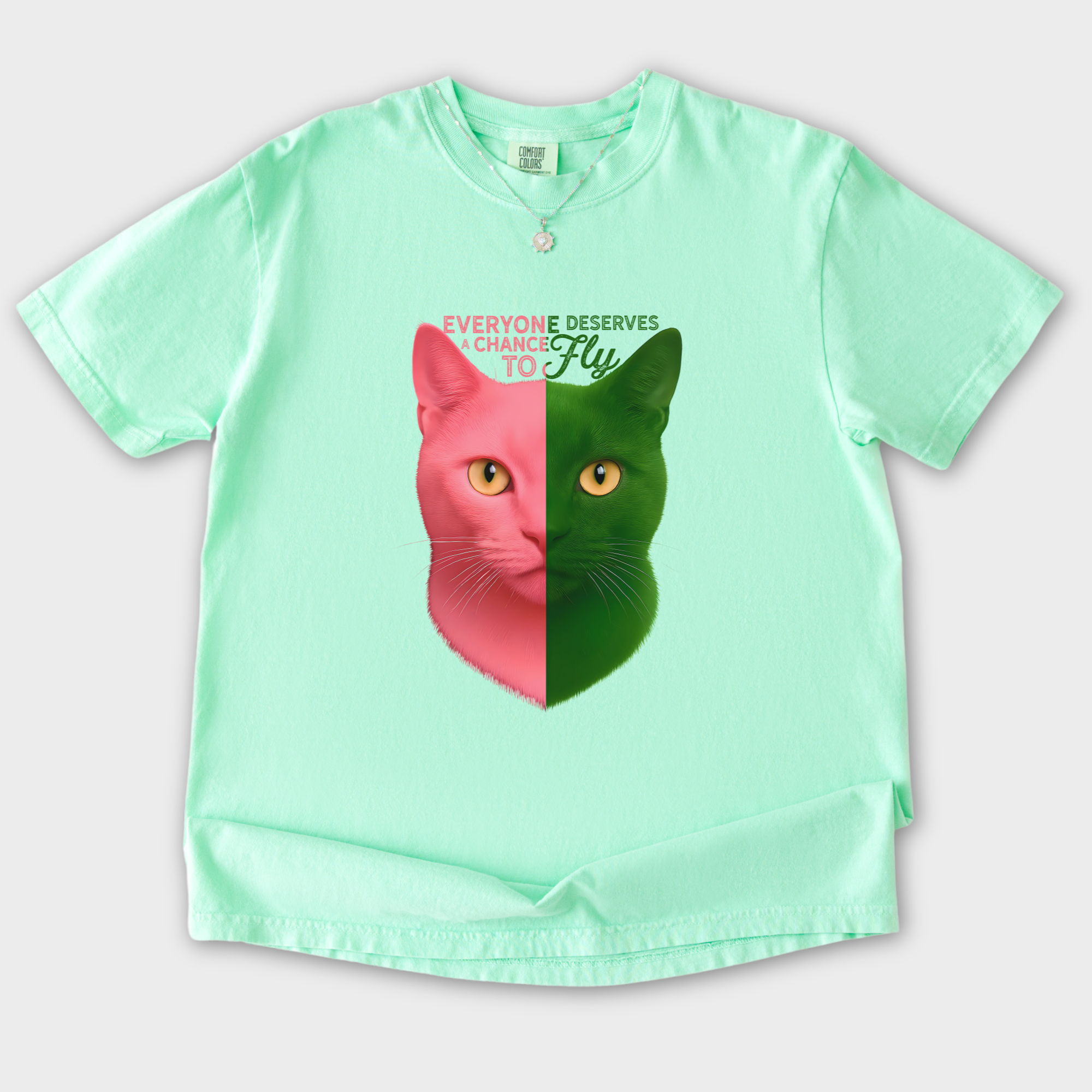 movie-inspired-everyone-deserves-a-chance-to-fly-cat-graphic-comfort-colors-t-shirt-in-island-reef - Island Reef Flat Lay Front