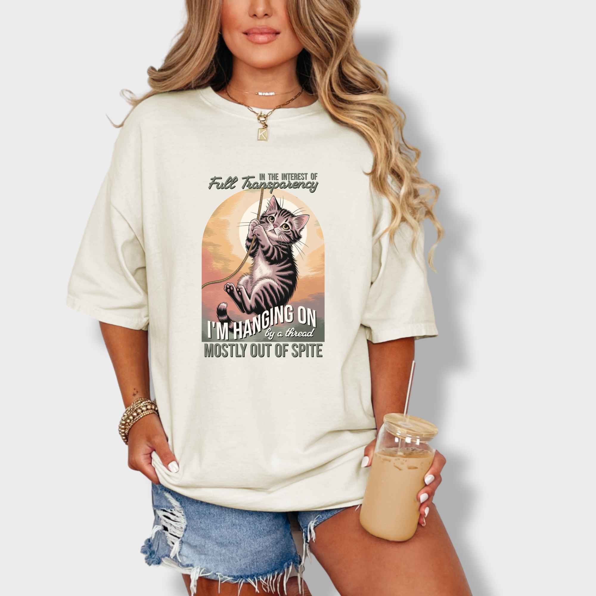 western-hanging-on-by-a-thread-cat-graphic-comfort-colors-t-shirt-in-ivory - Ivory Lifestyle Female Model