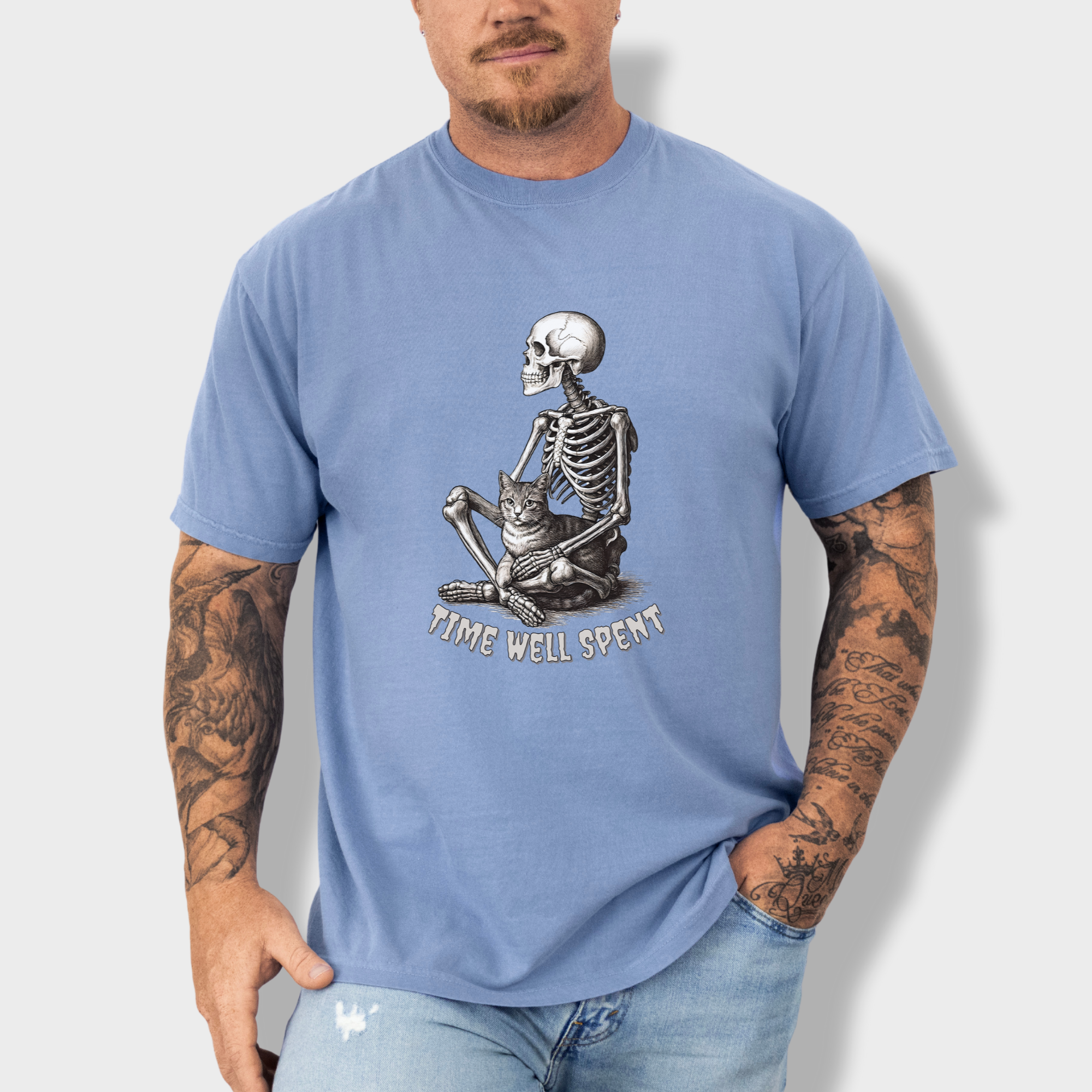 line-art-sit-still-skeleton-petting-cat-cat-skeleton-comfort-colors-t-shirt-in-washed-denim - Washed Denim Lifestyle Male Model