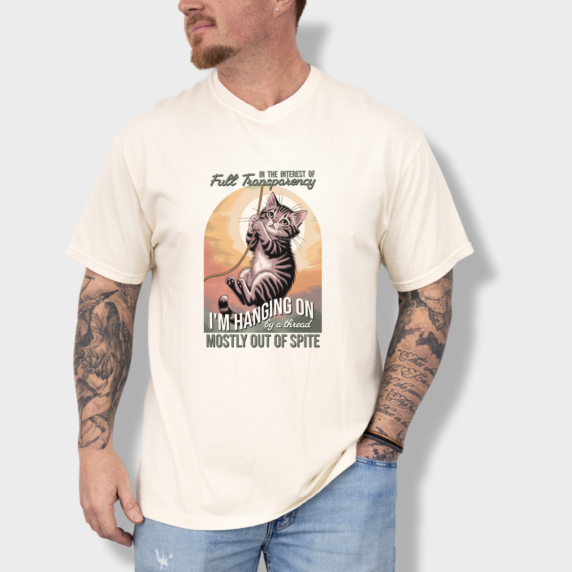 western-hanging-on-by-a-thread-cat-graphic-comfort-colors-t-shirt-in-ivory - Ivory Lifestyle Male Model