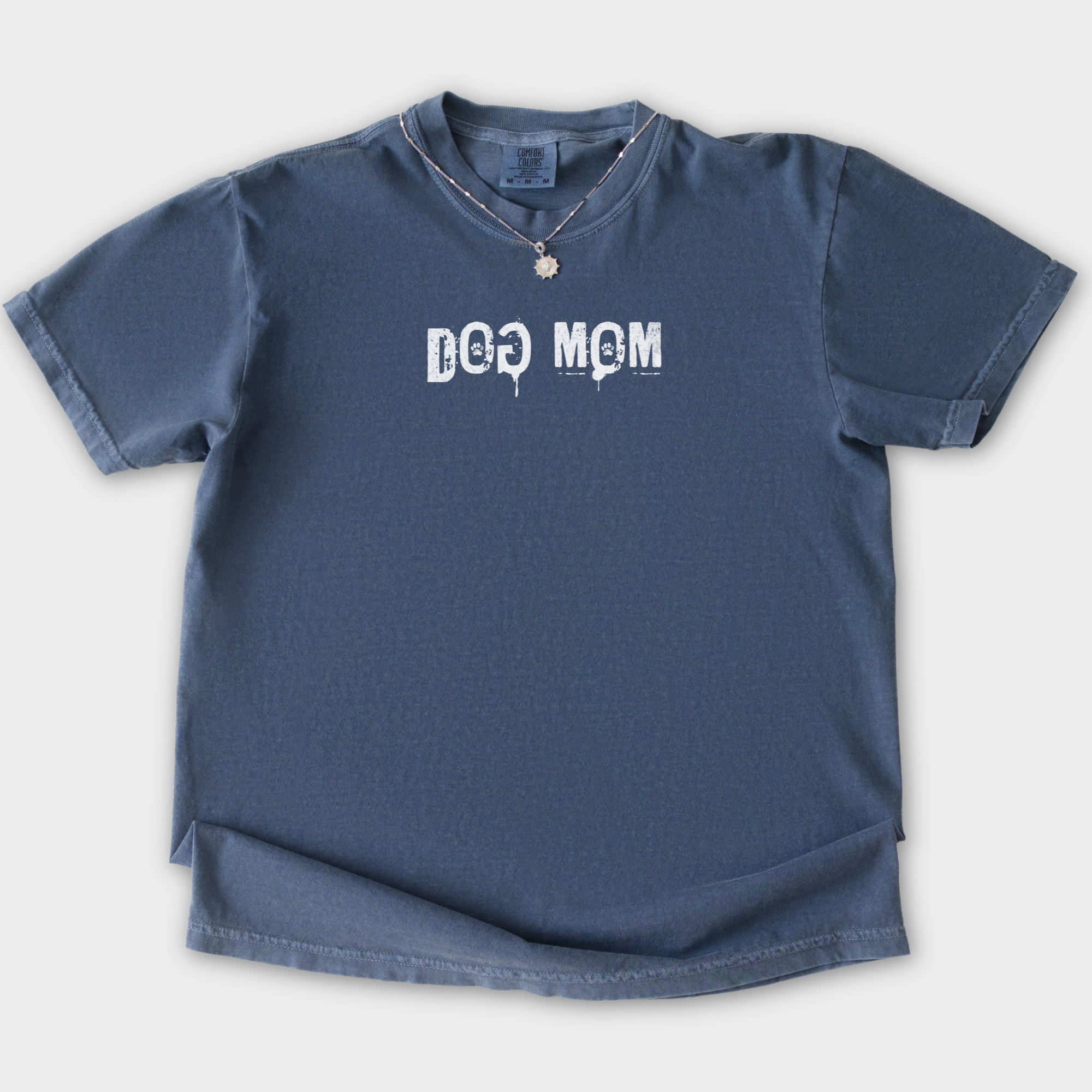 minimalist-dog-mom-messy-stamp-with-paint-splatter-dog-text-comfort-colors-t-shirt-in-denim - Denim Flat Lay Front