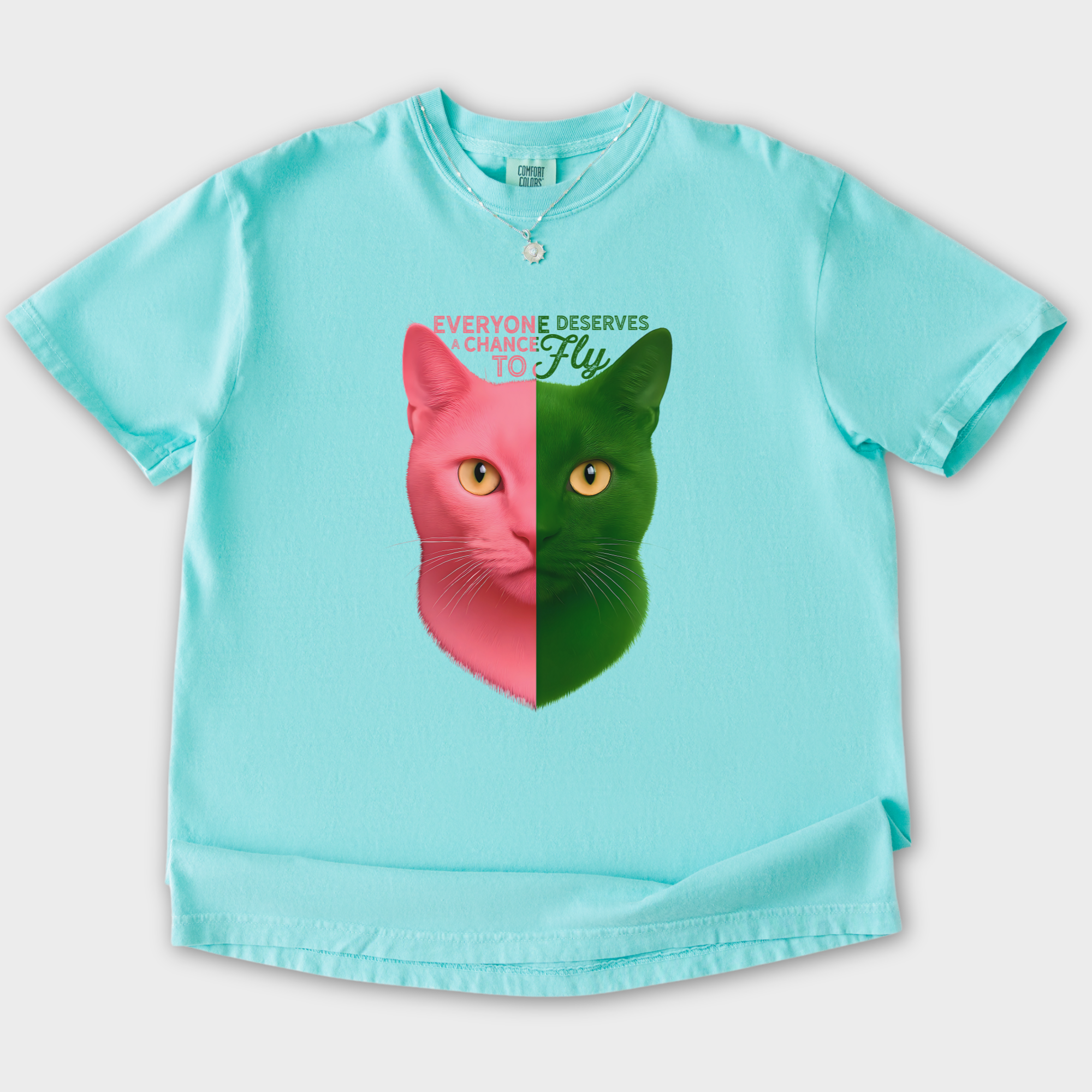 movie-inspired-everyone-deserves-a-chance-to-fly-cat-graphic-comfort-colors-t-shirt-in-chalky-mint - Chalky Mint Flat Lay Front